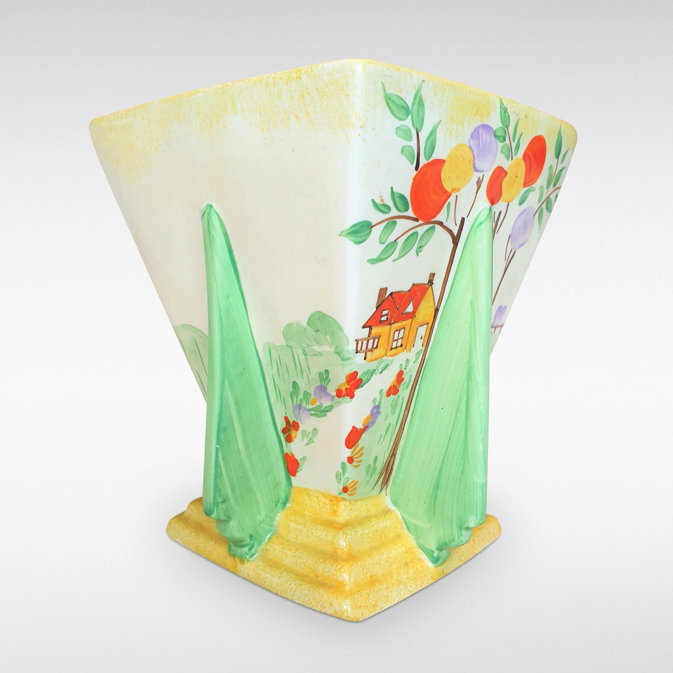 This Art Deco square flared vase, with a 'balloon trees' and cottage design dates from circa 1935. Jessie Hallen, the leading designer/sculptress of Wade Heath potteries was a contemporary of Clarice Cliff and Susie Cooper and like them had attended