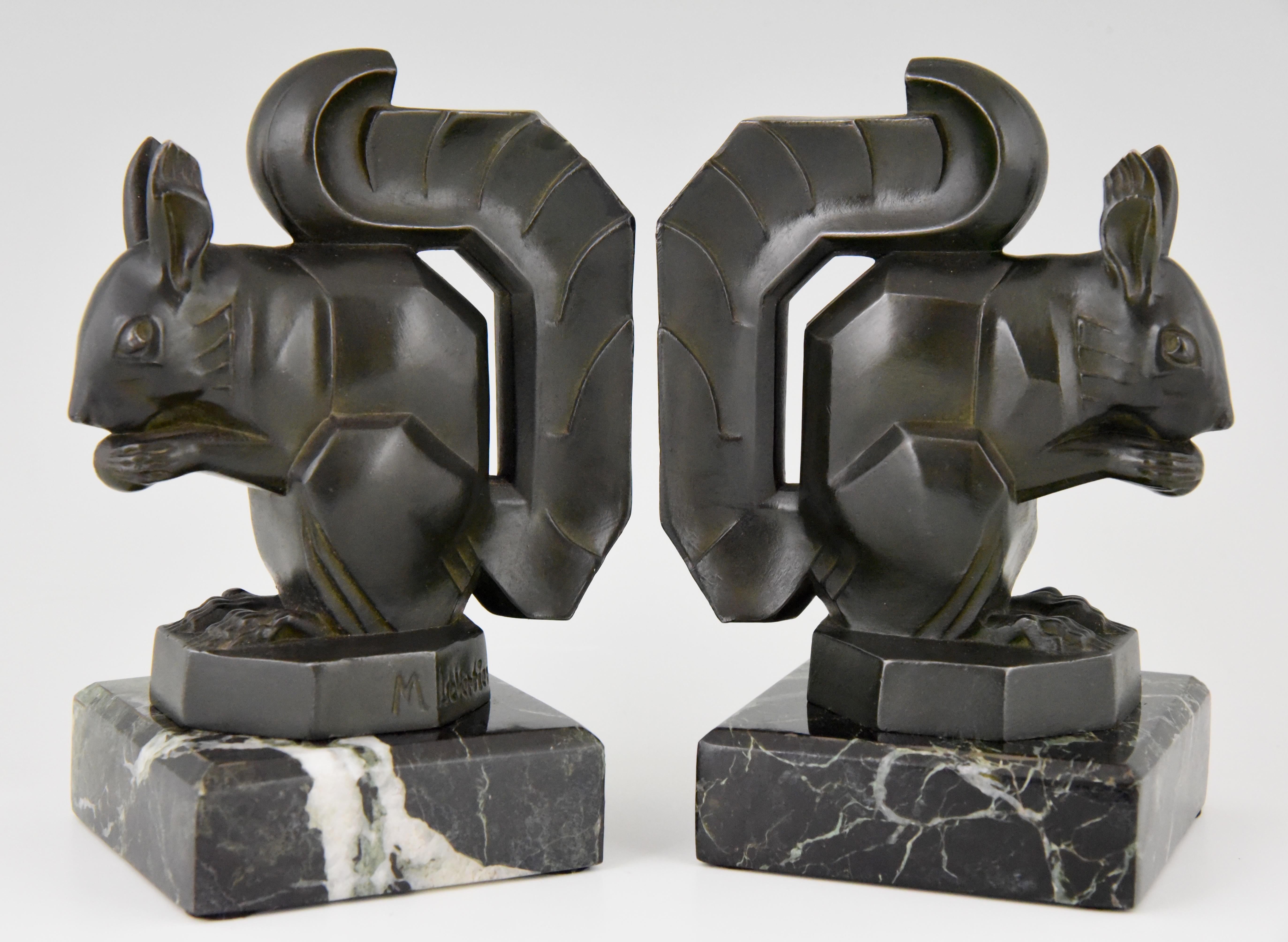 Lovely pair of typical Art Deco bookends with squirrels by Max Le Verrier, France, 1930.
Patinated art metal on a green marble base.