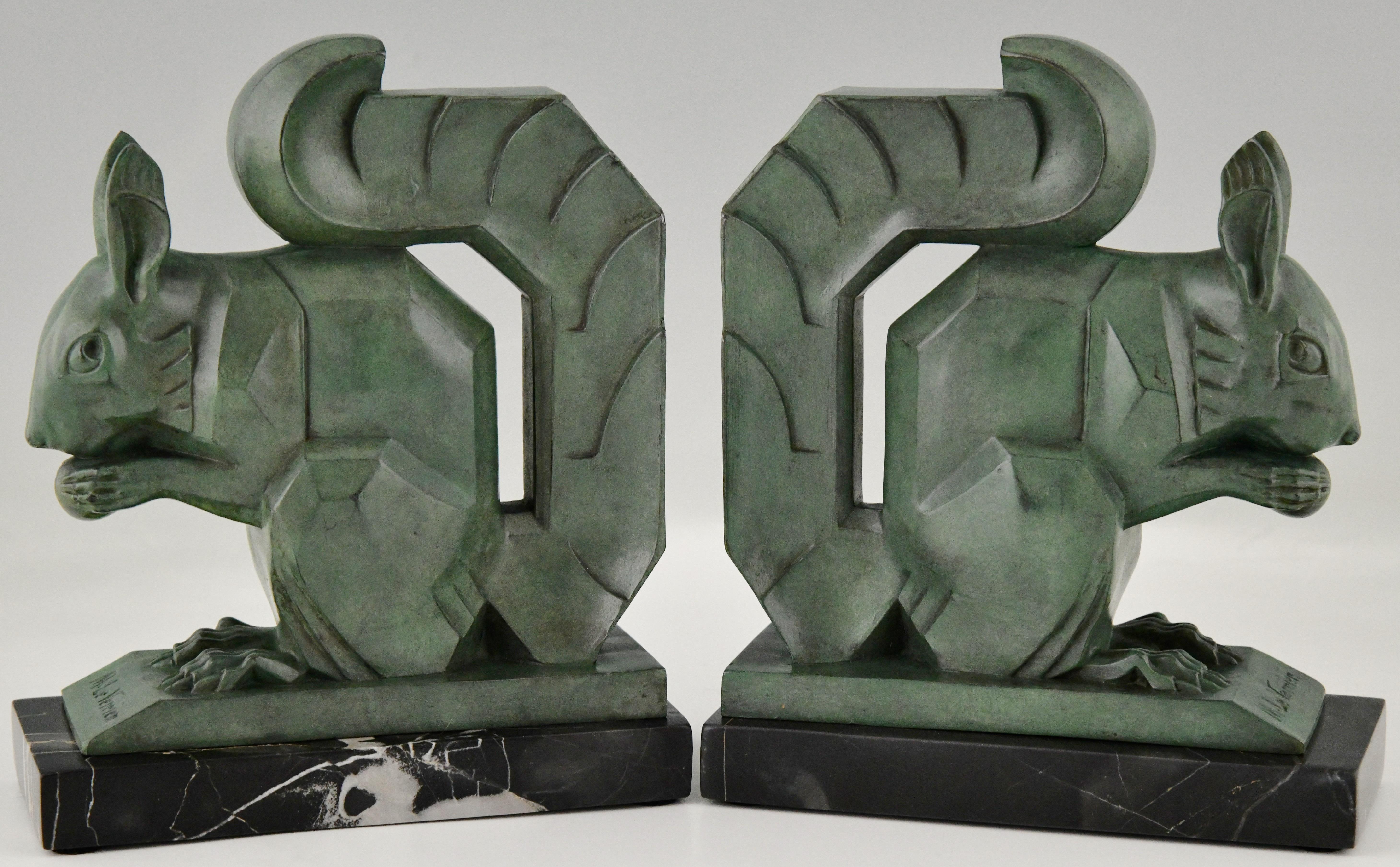 Art Deco squirrel bookends by Max Le Verrier.
The sculptures are in Art metal with green patina and stand on Portor marble bases.
France 1930.
This size is very hard to find.