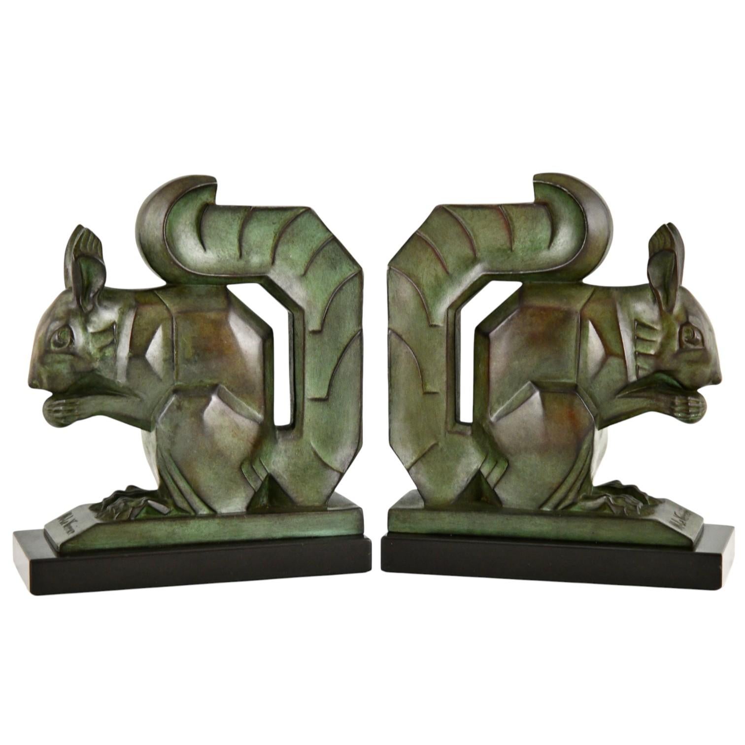 Art Deco squirrel bookends by Max Le Verrier.
The sculptures are in Art metal with green patina with brown shades 
They stand on Belgina Black marble bases.
France 1930.
This size is very hard to find.
Literature:
Art Deco sculpture by Victor Arwas,