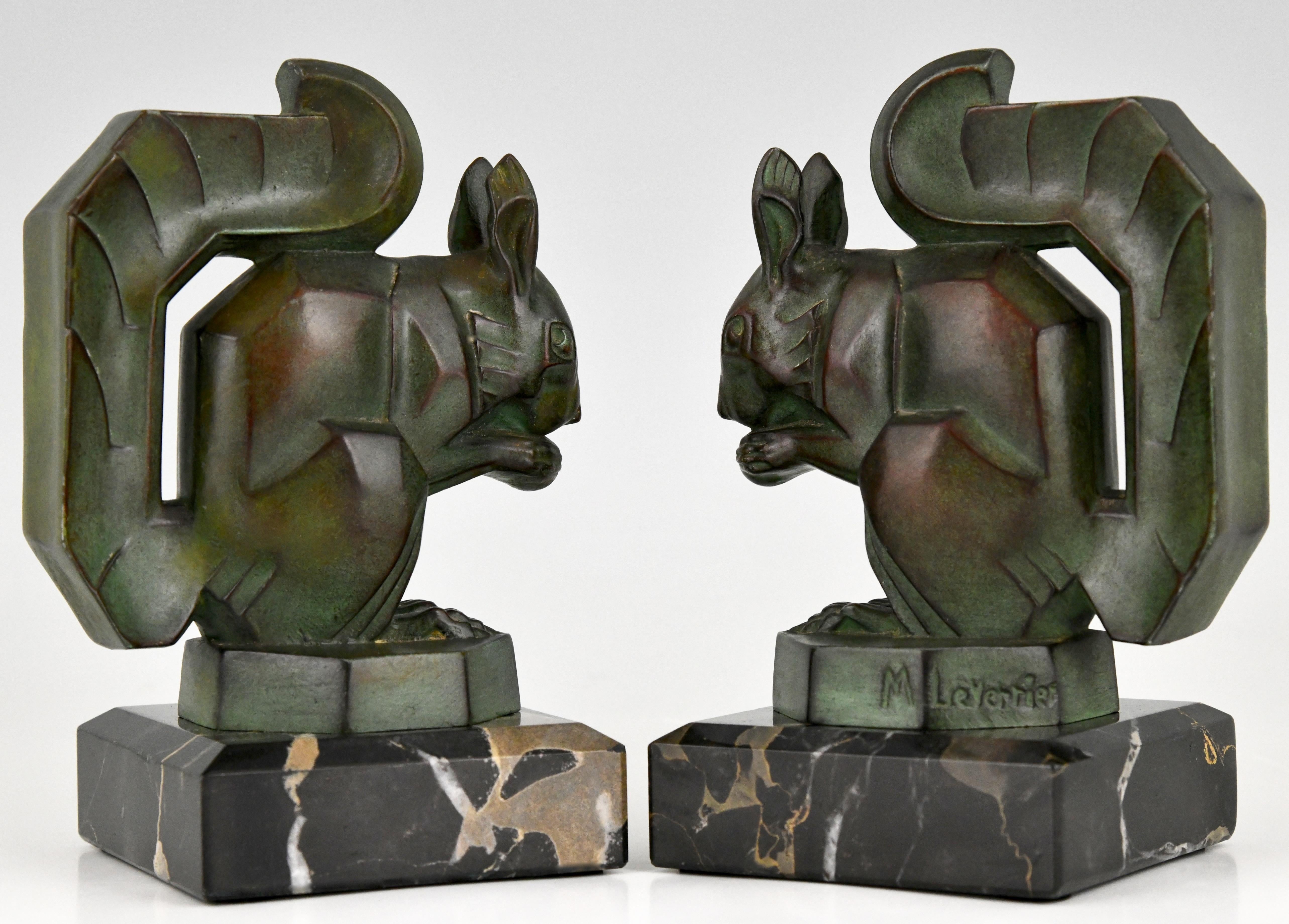 Art Deco bookends modelled as squirrels eating a nut signed by the French artist Max Le Verrier cast in art metal with lovely dark green patina on a Portor marble base, original ca. 1930.
“Art deco sculpture” by Victor Arwas, Academy.? “Bronzes,