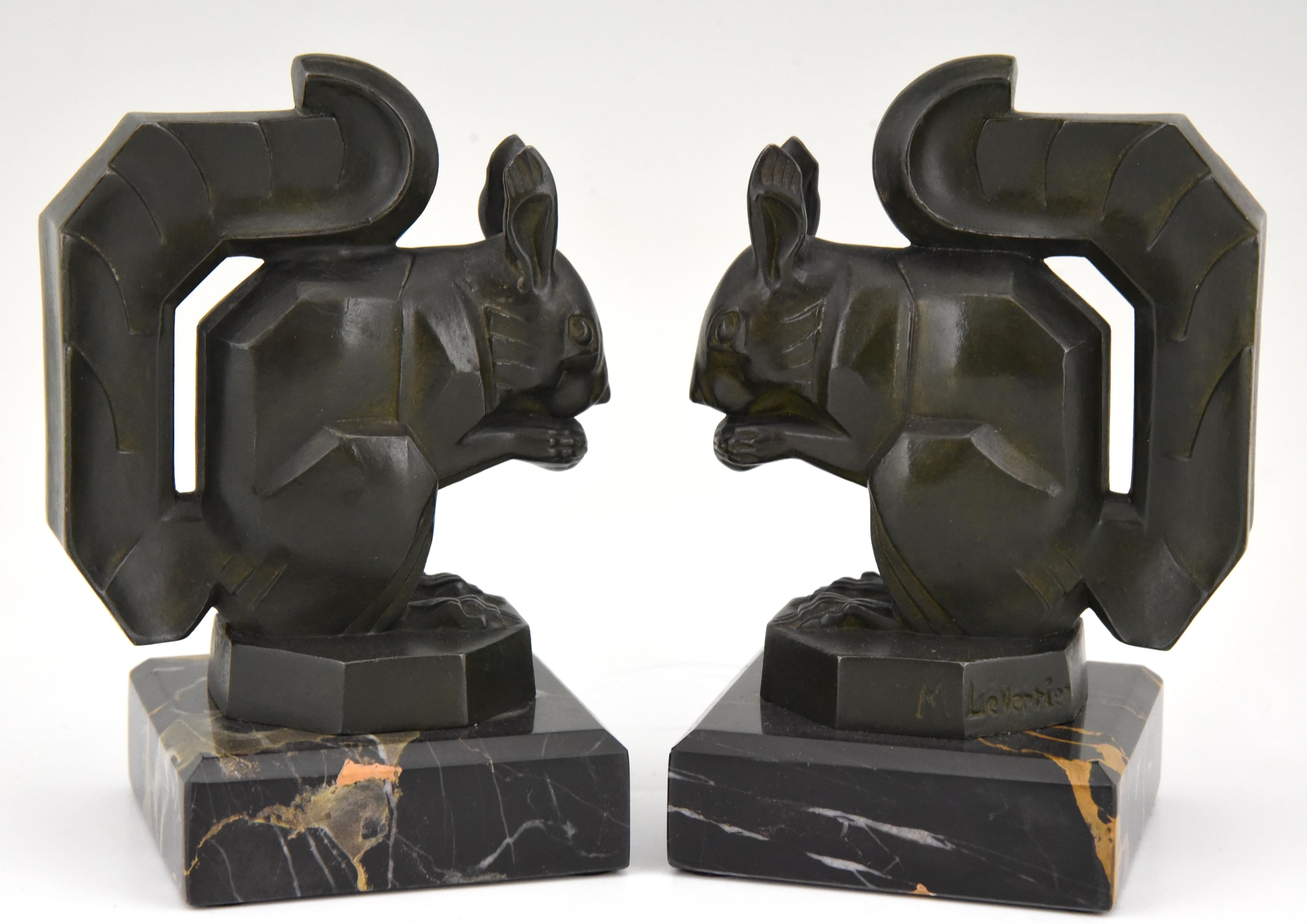 Art Deco bookends modelled as squirrels eating a nut signed by the French artist Max Le Verrier cast in art metal with lovely dark green patina on a Portor marble base, circa 1930.
Literature:
“Art deco sculpture” by Victor Arwas, Academy.