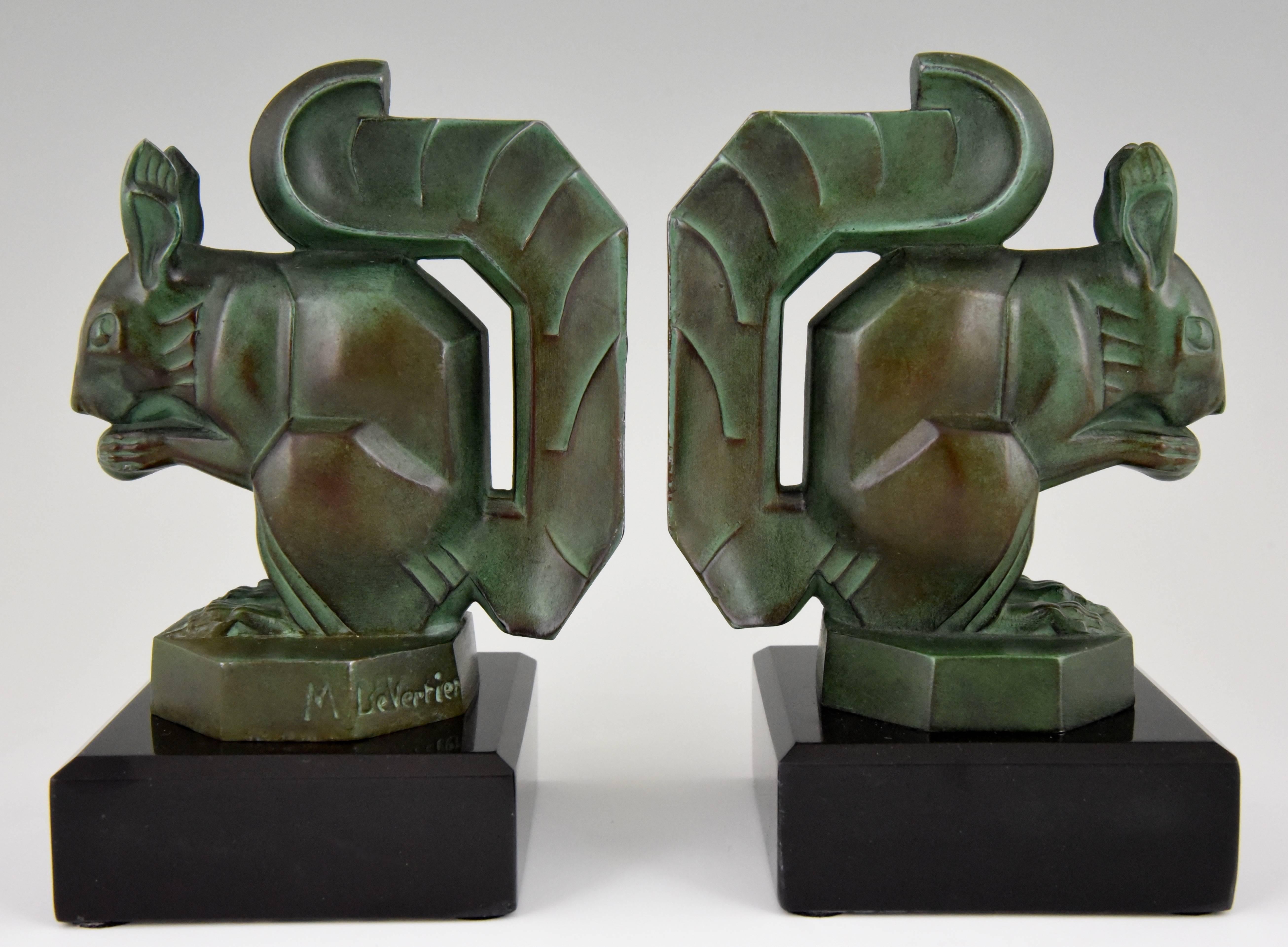 Typical Art Deco bookends with squirrels by the famous French sculptor Max Le Verrier, Art metal with green patina on Belgian black marble base.
Signature / Marks: M. Le Verrier.
Style: Art Deco.
Date: 1930.
Material: Green patinated metal.