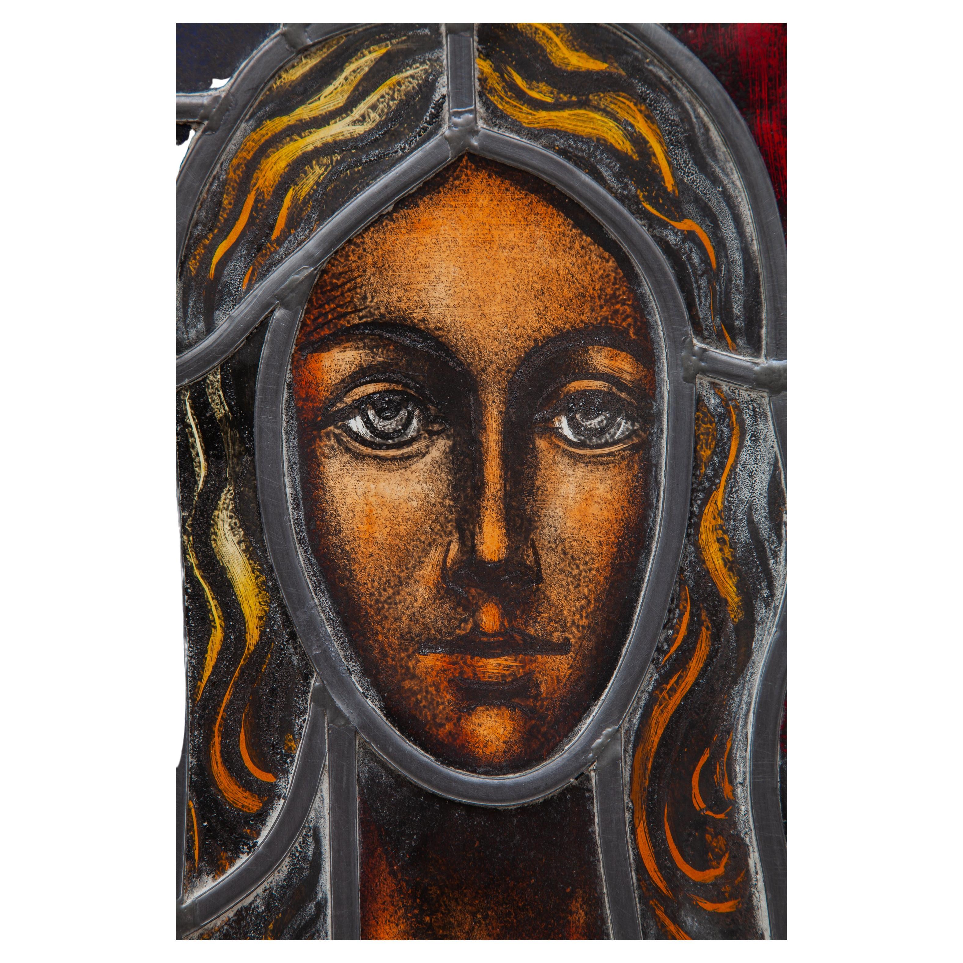 A beautiful woman portrait in the glass closed. A stained glass technique in glass gives a magical atmosphere when light falls and changes the color palette intensity during the course of the day. An Antique stained glass panel. Features a depiction