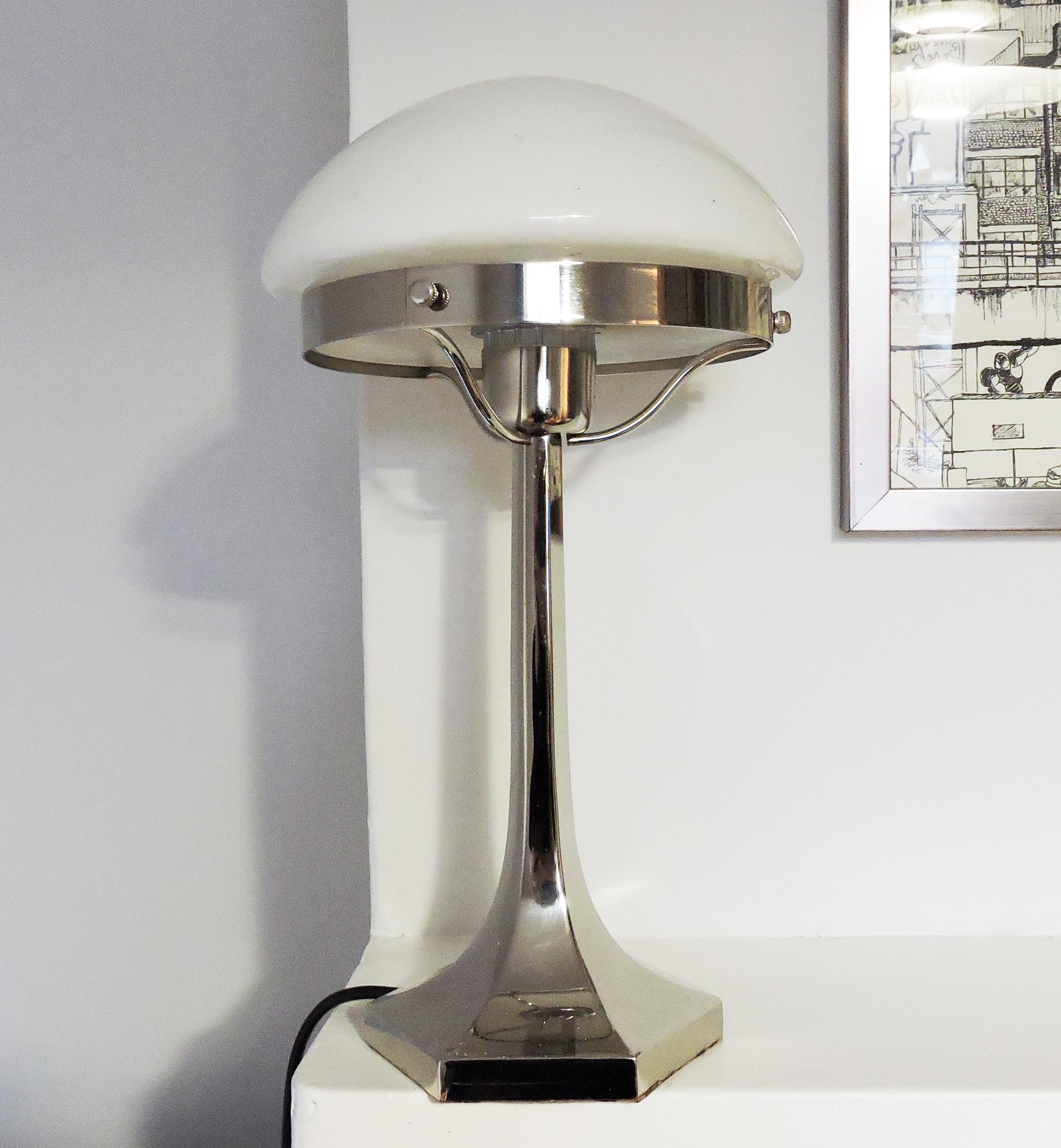 A 1920s Art Deco stainless steel table lamp from Lustrerie Deknudt.

A professional electrician has rewired this piece to be in working order.
Restoration and Damage Details - Rewired and/or new electrical components
Plug type - UK plug (up to