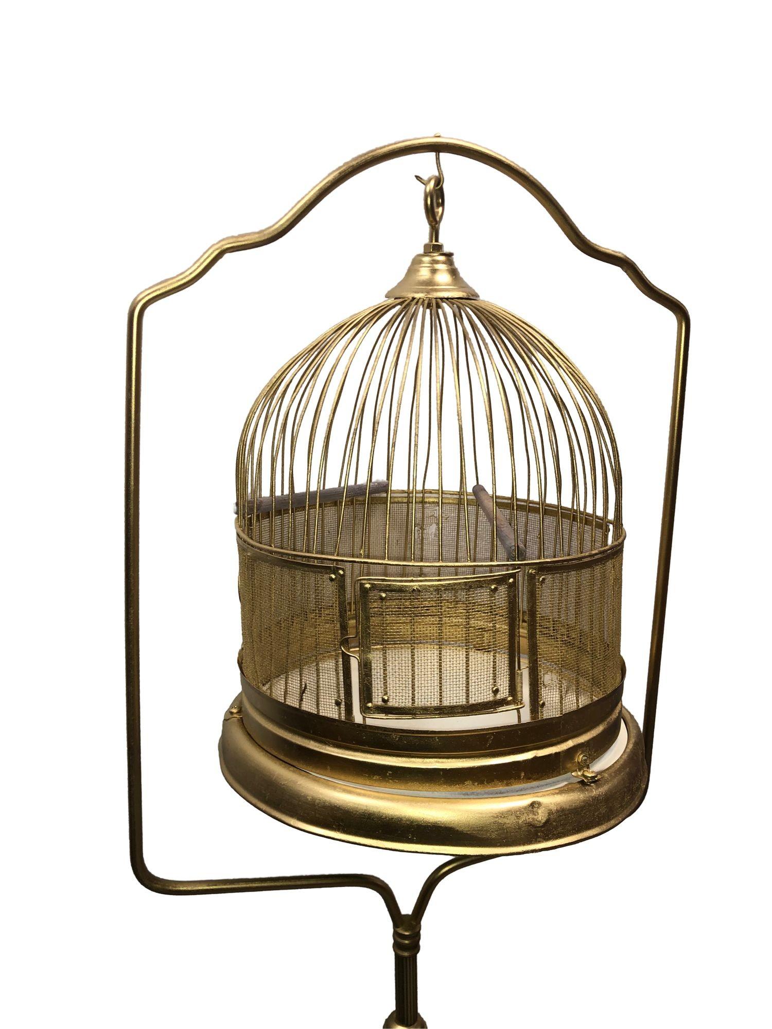 Elegant baroque Art Deco standing birdcage in a green faux jade and painted brass steel. Featuring two poles, a front door, and ornate etched details. Restored and newly painted, this decorative piece blends vintage charm with refined