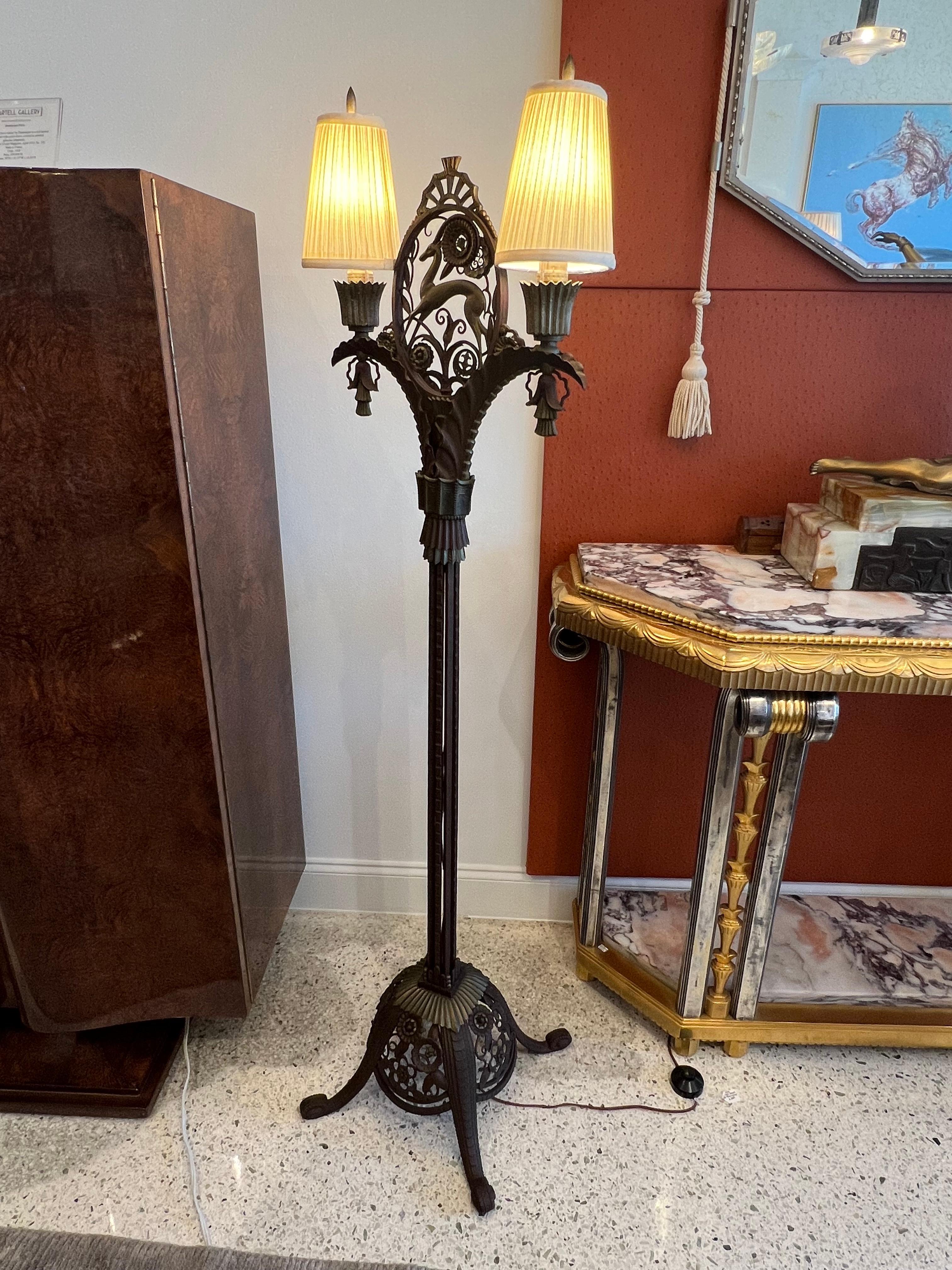 A Beautiful Art Deco Standing Lamp in Wrought Iron and Silk Shades, depicting a deer and deco flowers motive, the design elements are traditional works of the french artist Edgar Brandt.