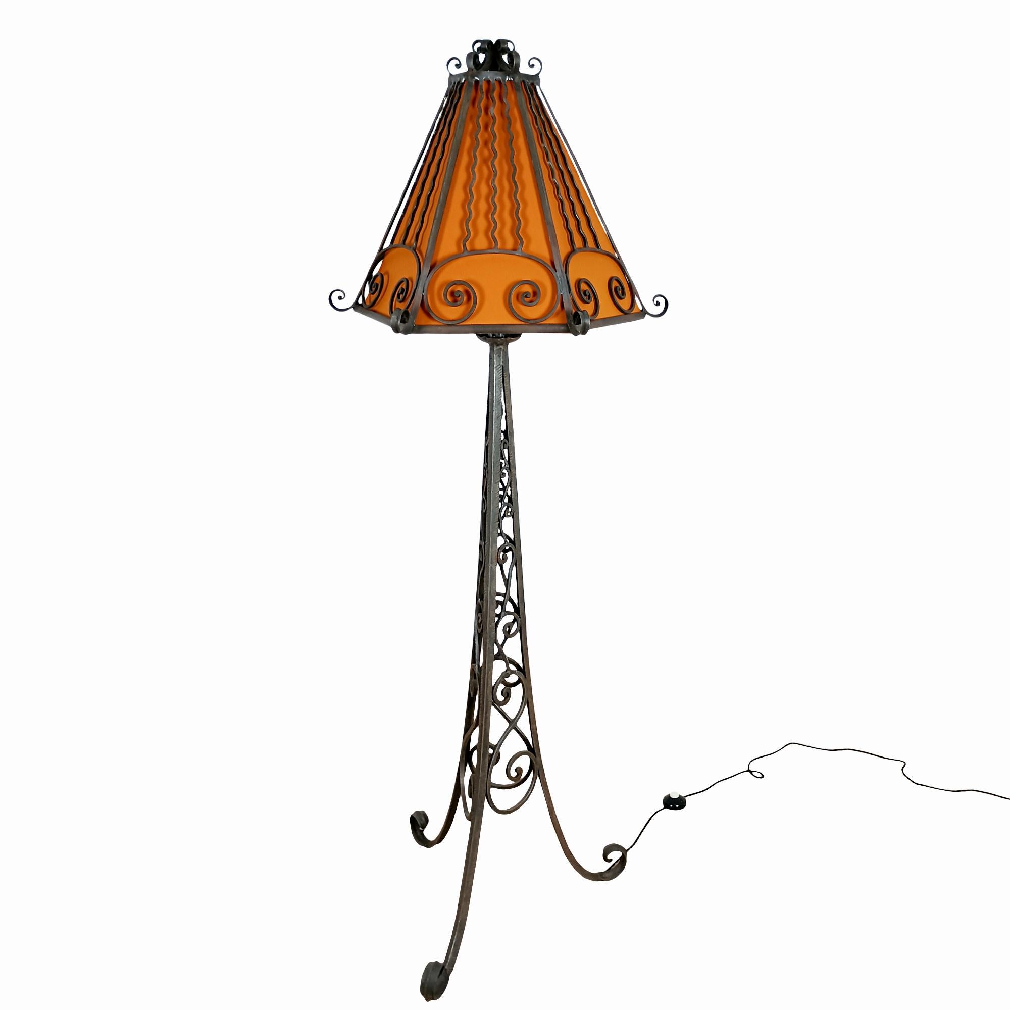 Art Deco standing lamp in wrought iron with new lampshade in rust canvas.

France circa 1920.