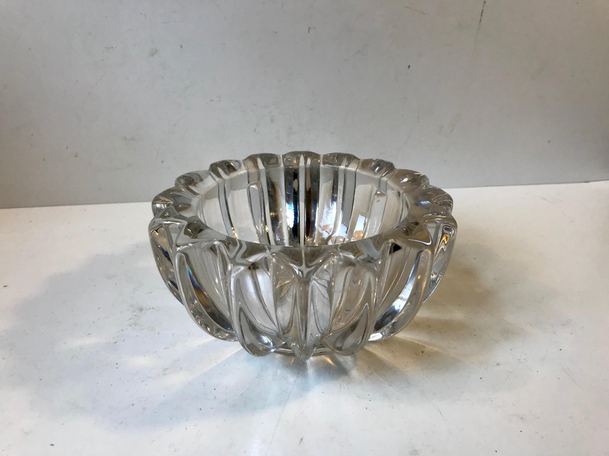 Thick star shaped glass dish designed by Pierre D’avesn during the 1930s. Would make a great candy or chocolate bowl for Christmas. It is signed/marked by the maker to the base.