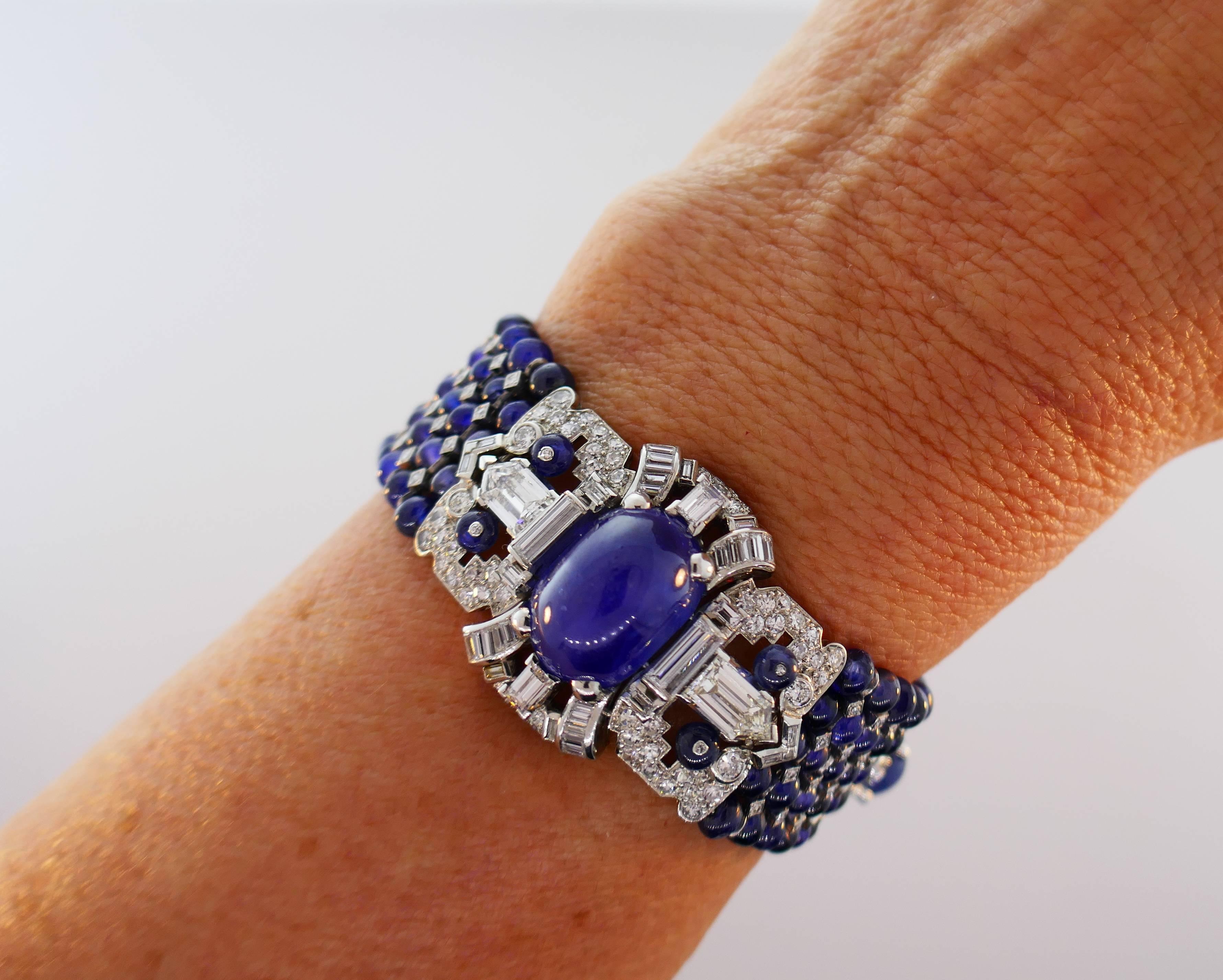 Stunning Art Deco bracelet featuring 17-carat natural not treated oval cabochon Star sapphire. The bracelet is made of platinum, cabochon star sapphires, sapphire beads and diamonds. The center 17-carat star sapphire comes with a Colored Stone