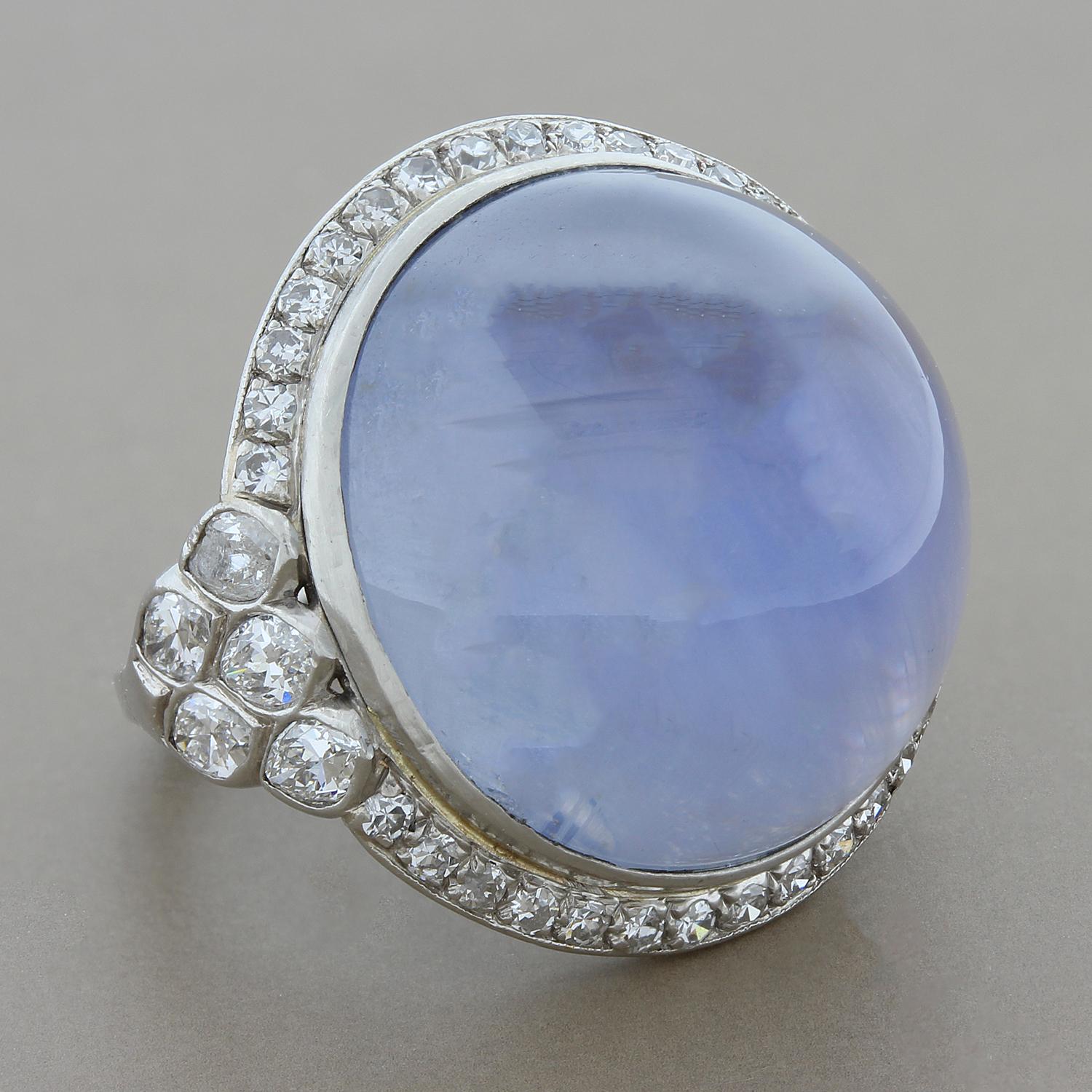 This Art Deco Style ring features a magnificent semi-translucent 35 carat star sapphire. The sapphire is haloed by 1.37 carats of round cut diamonds and two clusters of marquise cut diamonds, set in platinum.

Ring Size 4 (Sizable)
