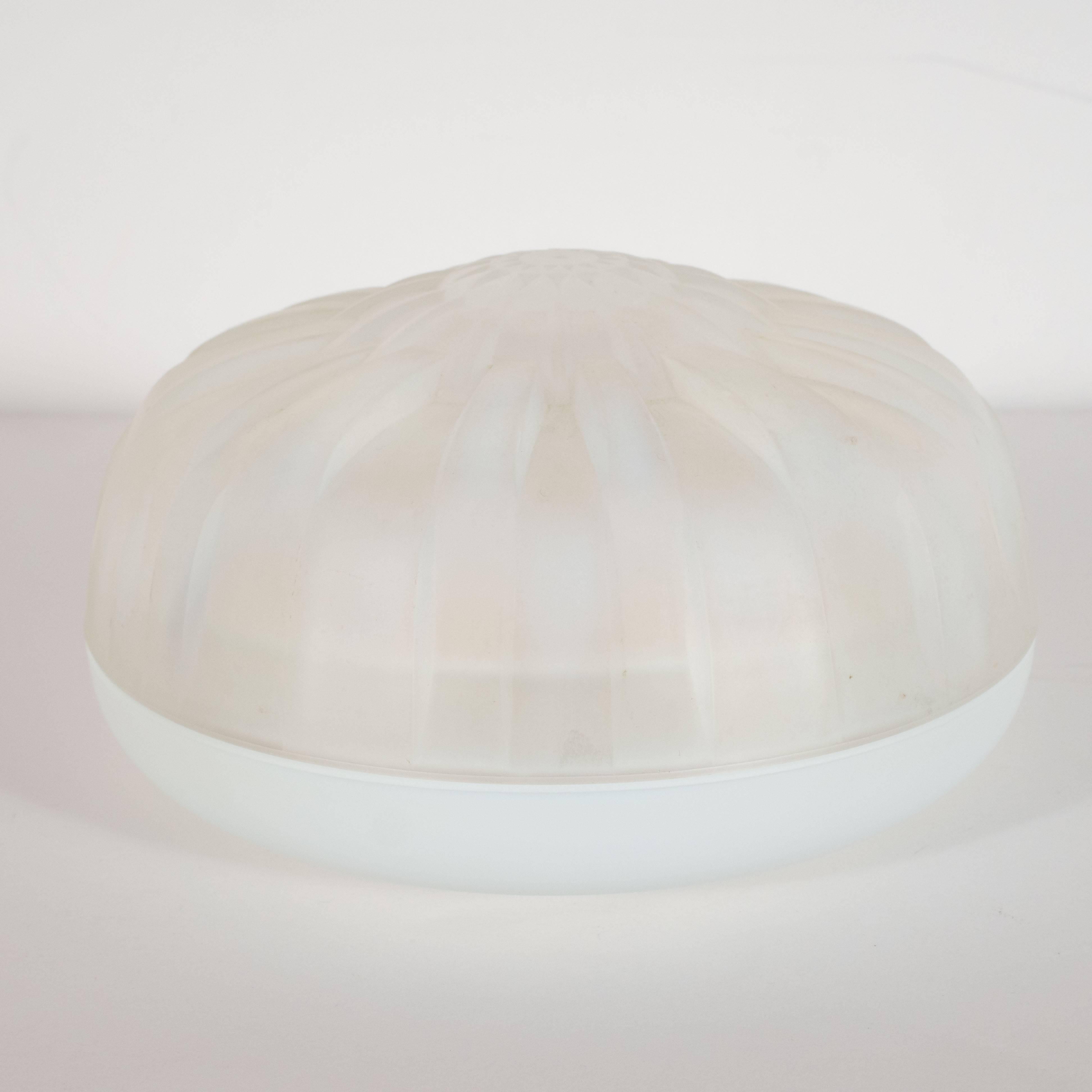 This dynamic and refined decorative dish/ box was handblown by Andre Hunebelle- one of the era's most celebrated glass ateliers- in France, circa 1930. The circular base supports a top with an abundance of bands emanating outwards- in a sunburst