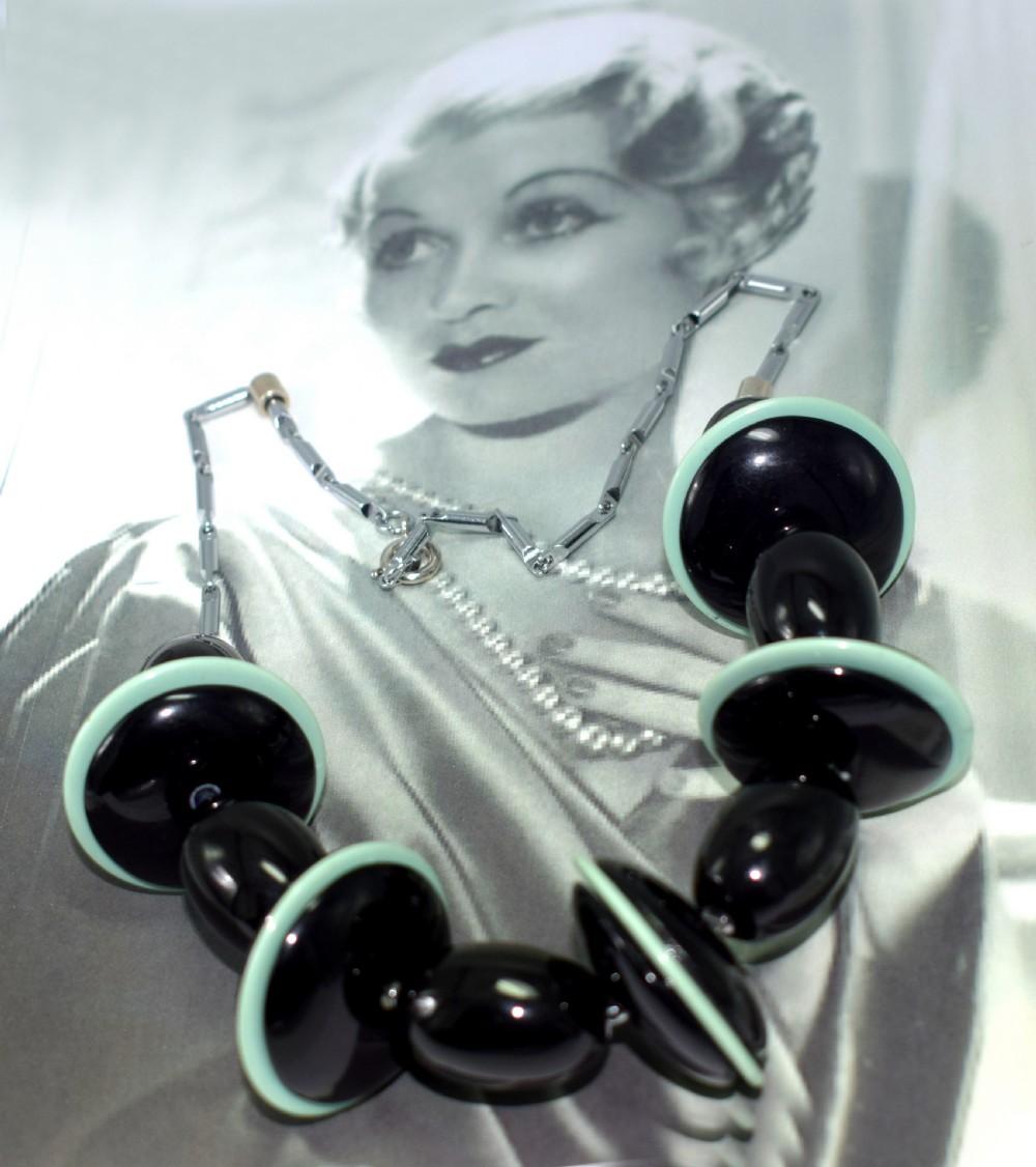 Timeless Art Deco ladies necklace by Jacob Bengel. Alternated large discs and balls made from Black and green galalith mounted on a chrome chain, so easily integrated with today's modern fashion savvy lady which is testament to how advanced the Art