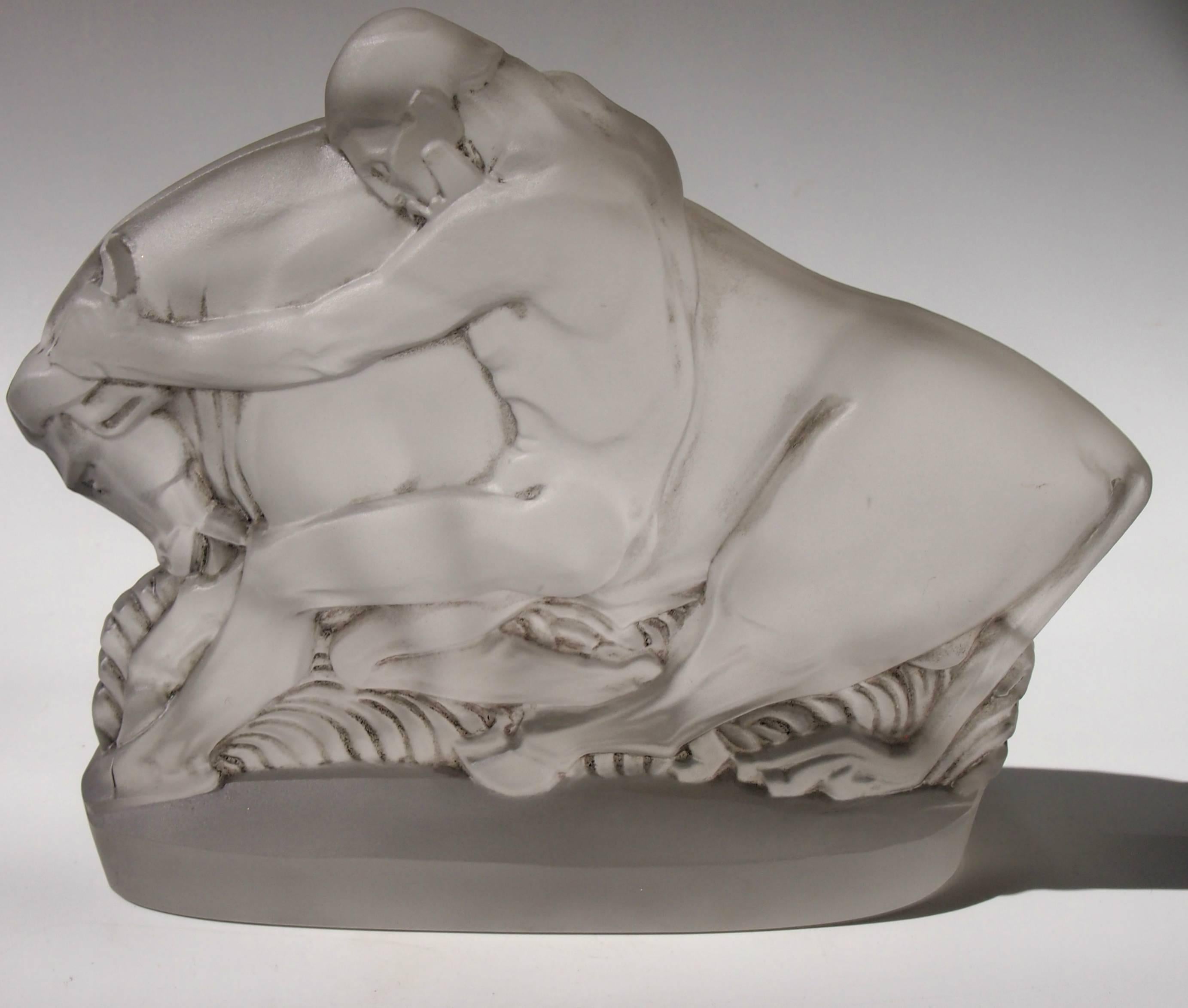 Possibly the most iconic piece of British Art Deco glass. This is a statue of Hercules capturing the Cretan Bull designed by Walter Gilbert for John Walsh Walsh -part of their Vesta range. This depicts the 7th Labour of Hercules. Original grey