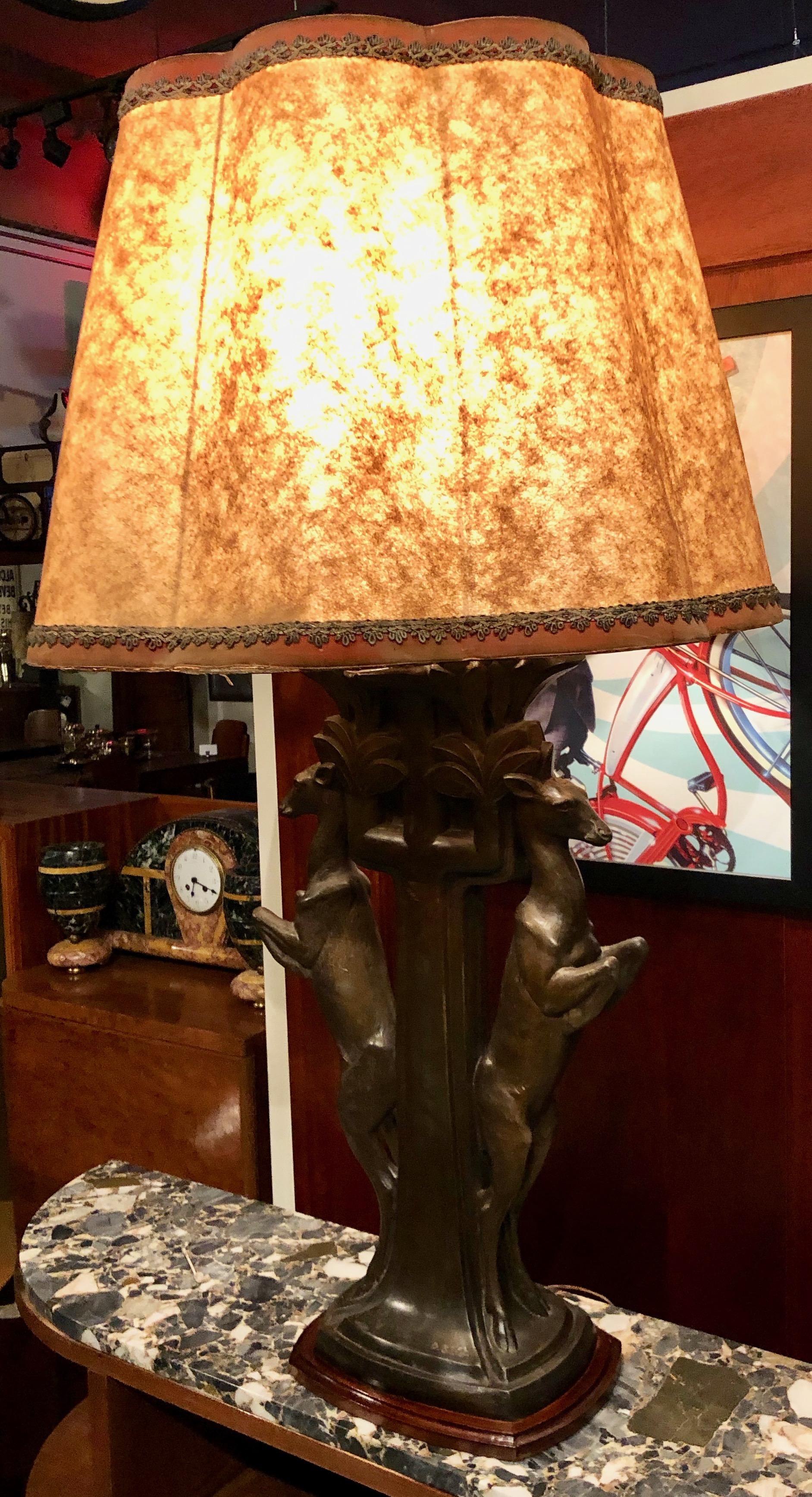 French statue/table lamp signed P. Sega France. Original piece in excellent condition. Even the shade, a kind of framed parchment with metal frame is original (although not perfect), it shows very well. The form is very natural, from the period