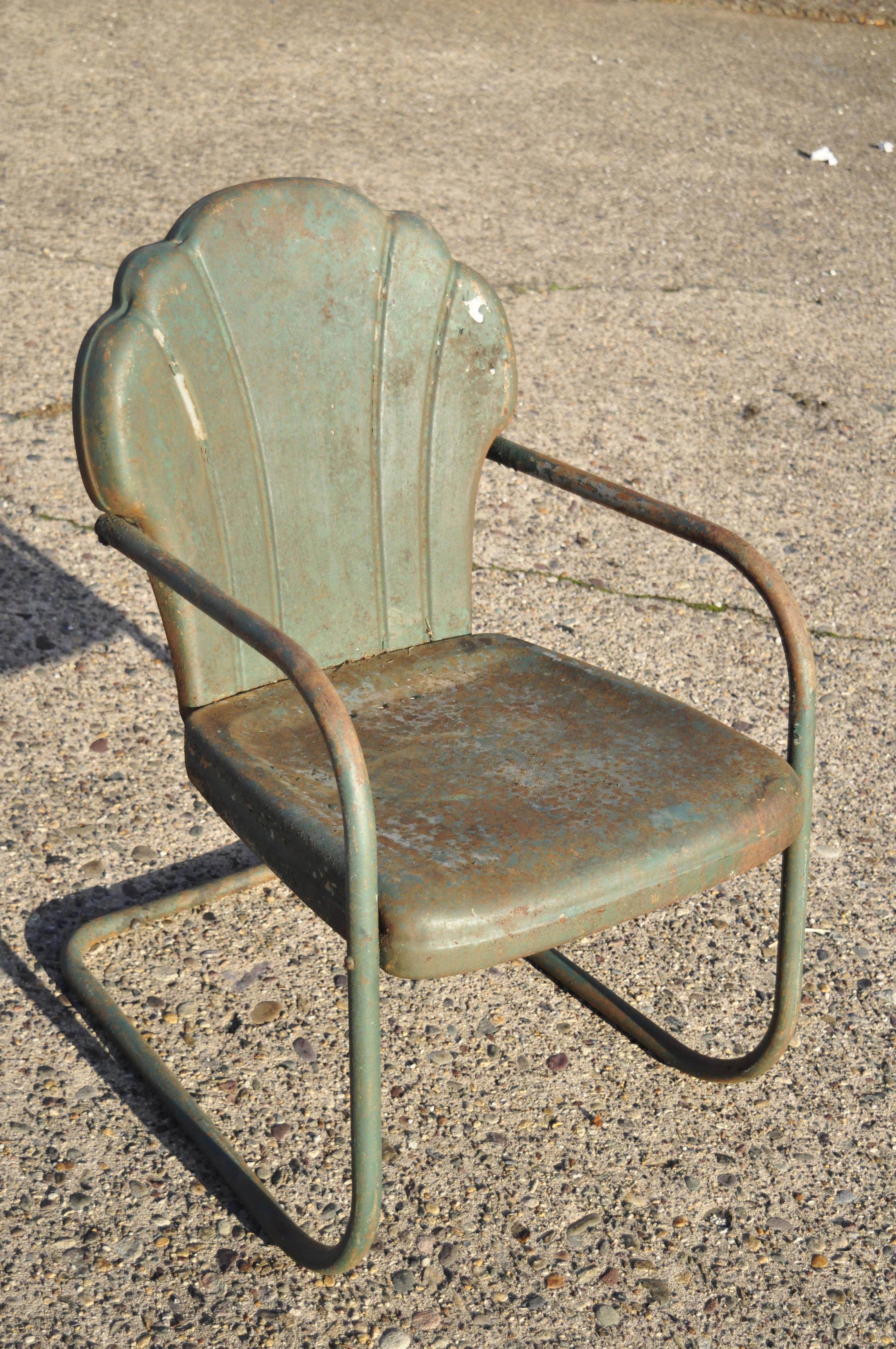 Antique Art Deco steel metal clam shell back green patio bouncer lounge chairs - a pair. Item features distressed green painted finish, 