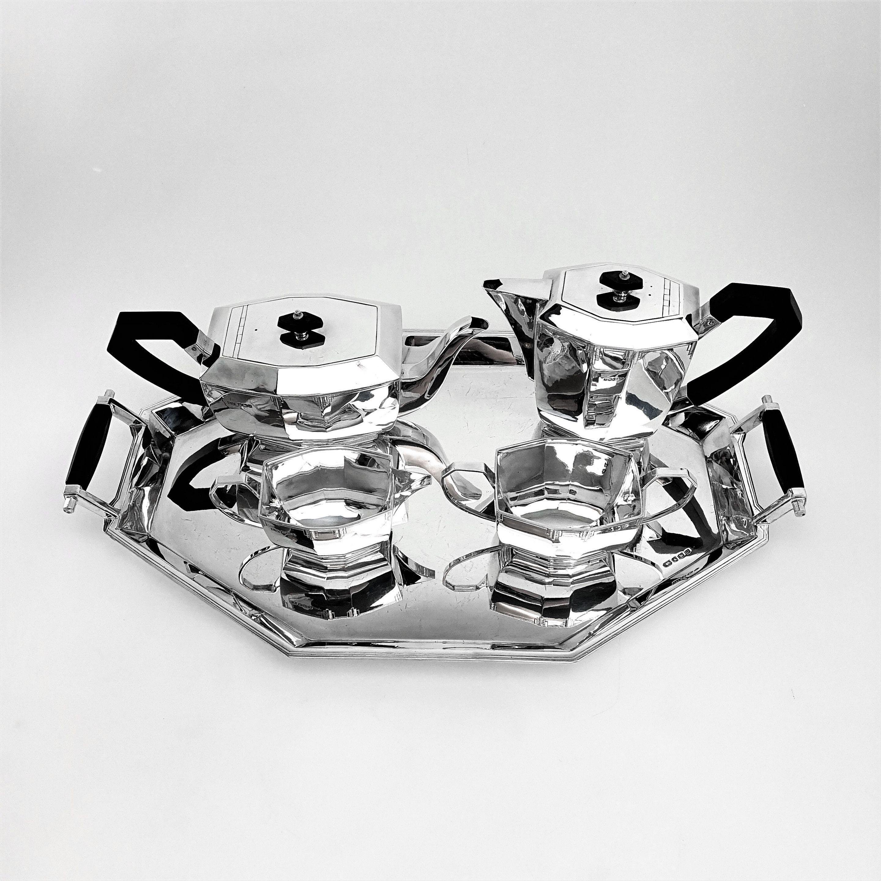 A gorgeous solid silver Art Deco tea set on tray. This Classic set is made in a style typical of early Art Deco period designs. Each piece of the tea and coffee set has a panelled octagonal shape and are embellished with a sublte geometric engraved