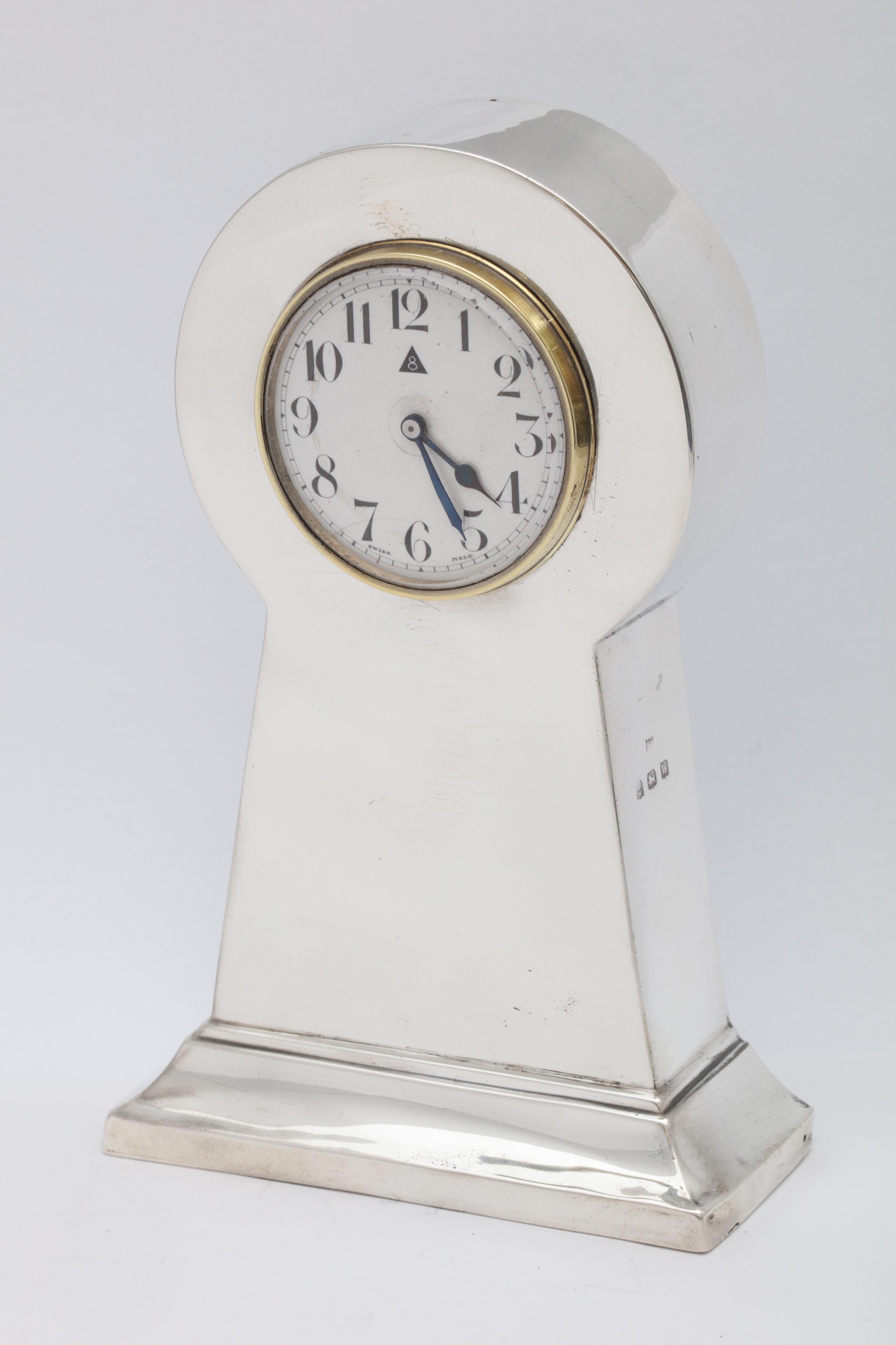 Art Deco, sterling silver, 8-day table clock, Birmingham, England, 1921, Charles S. Green and Co. - makers. Measures: Stands 5 1/2 inches high x 3 1/2 inches wide x over 1 1/2 inches deep. Has a few minor dints in the sterling silver and some