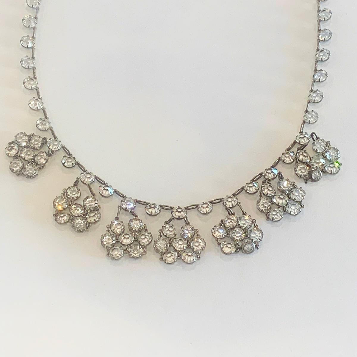 Stunning Art Deco Necklace in Sterling Silver with ring mounted finely facetted mine crystal that sparkles with movement. Totally perfect with no damage, no losses. Original ring clasp Hallmarked “STERLING”, indicating U.S.A. Silver manufacture.