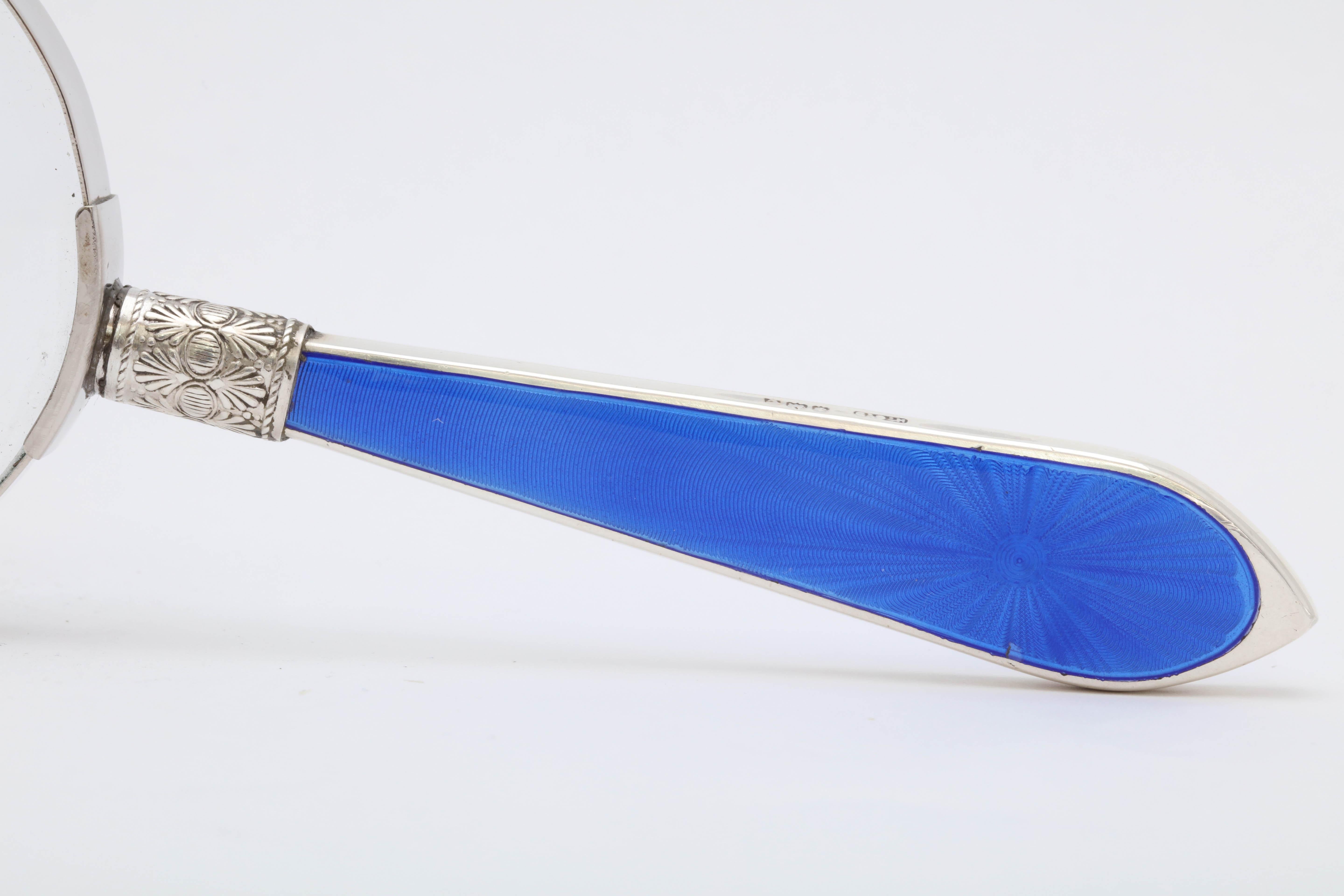 Art Deco, sterling silver and deep blue guilloche enamel-mounted magnifying glass, Birmingham, England, 1927, Henry C. Davis - maker. Glass itself has metal surround. Sterling silver handle is enameled on both sides, each side having a starburst