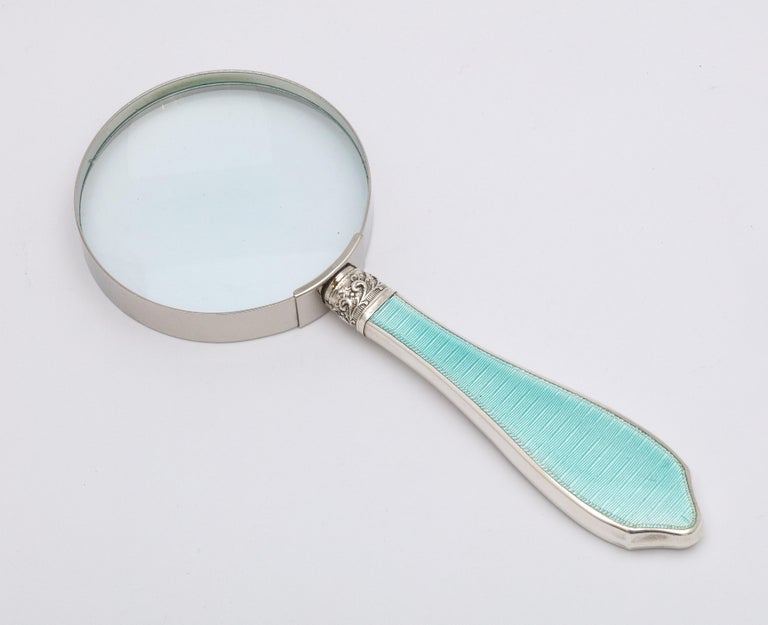 Art Deco, sterling silver and light turquoise guilloche enamel-mounted magnifying glass, Birmingham, England, year-hallmarked for 1928, W.I. Broadway and Co. - makers. Measures 6 1/2 inches long x over 2 1/2 inches diameter across glass. Glass
