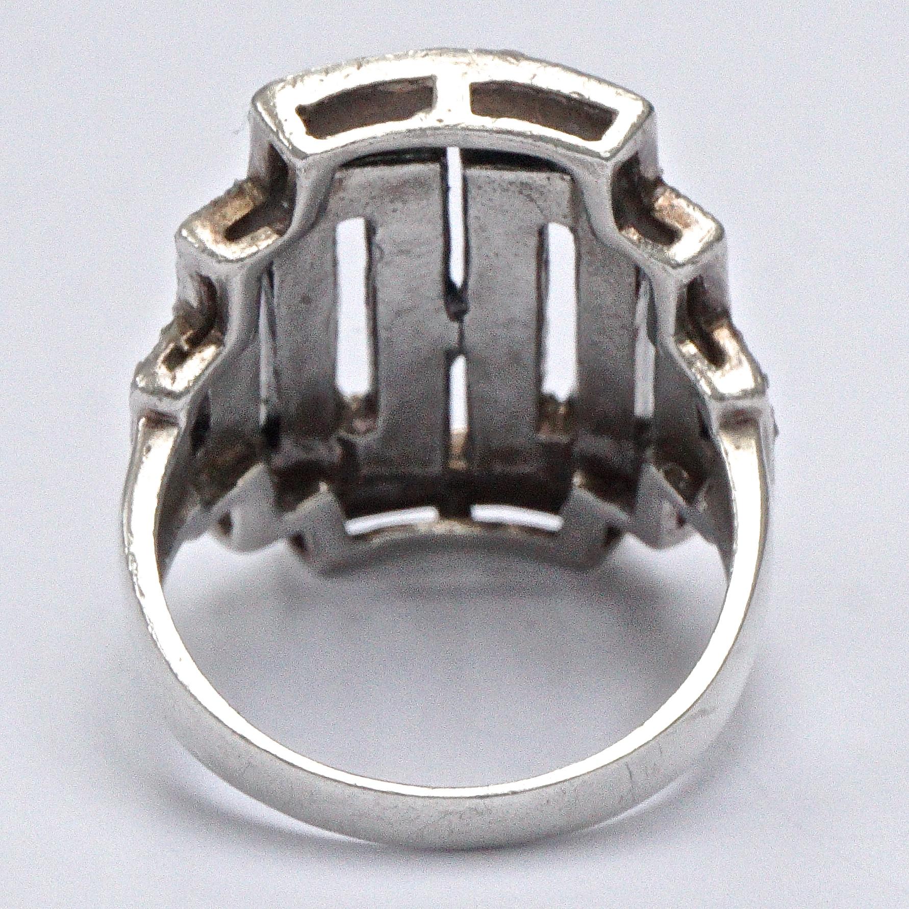 Art Deco sterling silver rectangular ring set with faceted marcasites, and decorated with millgrain edging decoration. Ring size UK O / US 7, inside diameter 1.8cm, and the front is length 2.3cm / .9 inch. There is wear as expected, and some of the