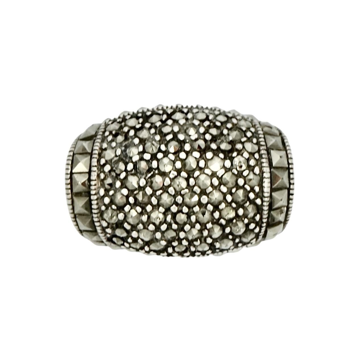 Wonderful Art Deco sterling silver tank ring set with faceted marcasites, and decorated with millgrain edging. Ring size UK O / US 7, inside diameter 1.85 cm, and the front is width 2.3 cm / .9 inch. There is wear as expected, and some of the