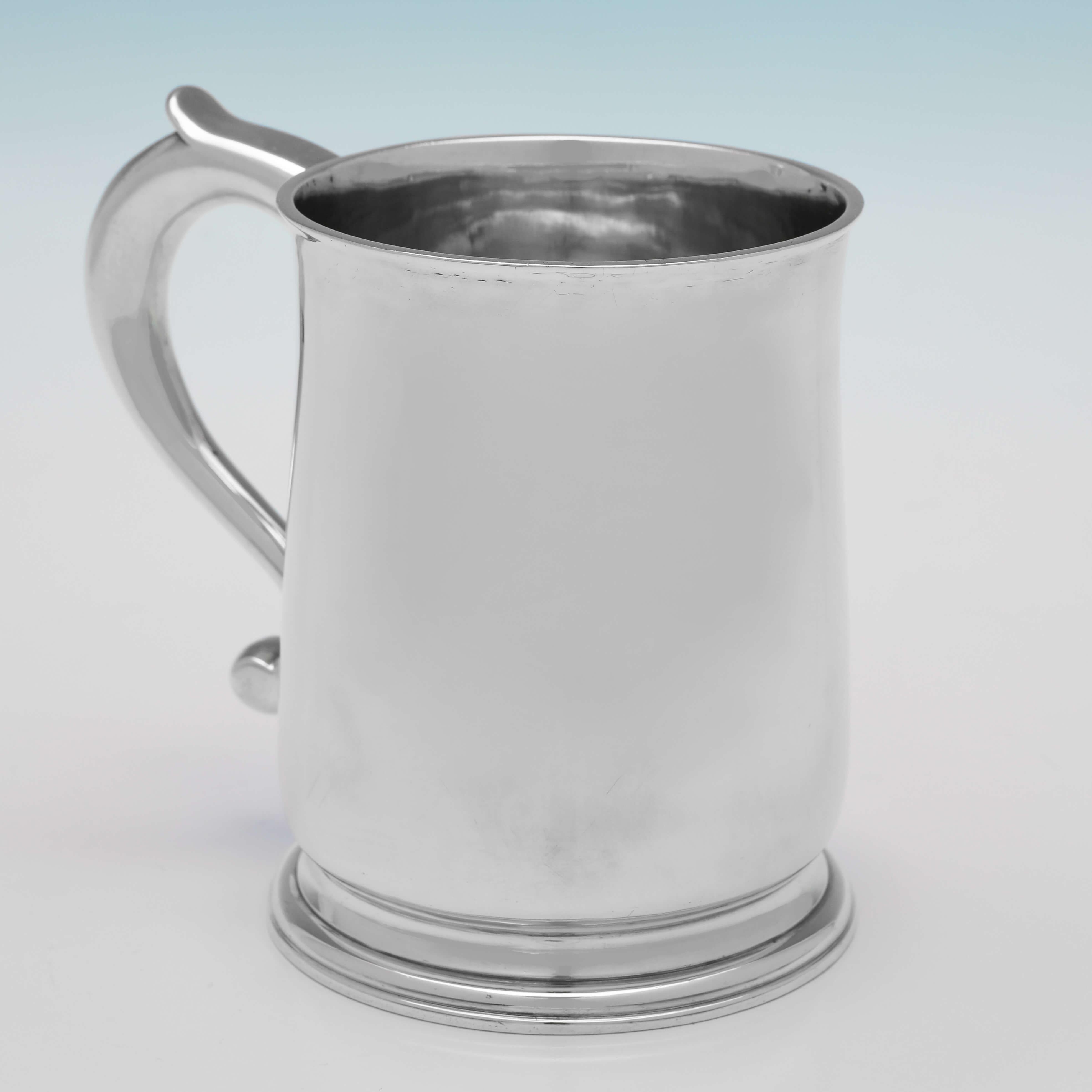 Hallmarked in London in 1935 by C. J. Vander, this handsome, Sterling Silver Mug, is an elegant art deco representation of a traditional beer mug. 

The mug measures 4.5