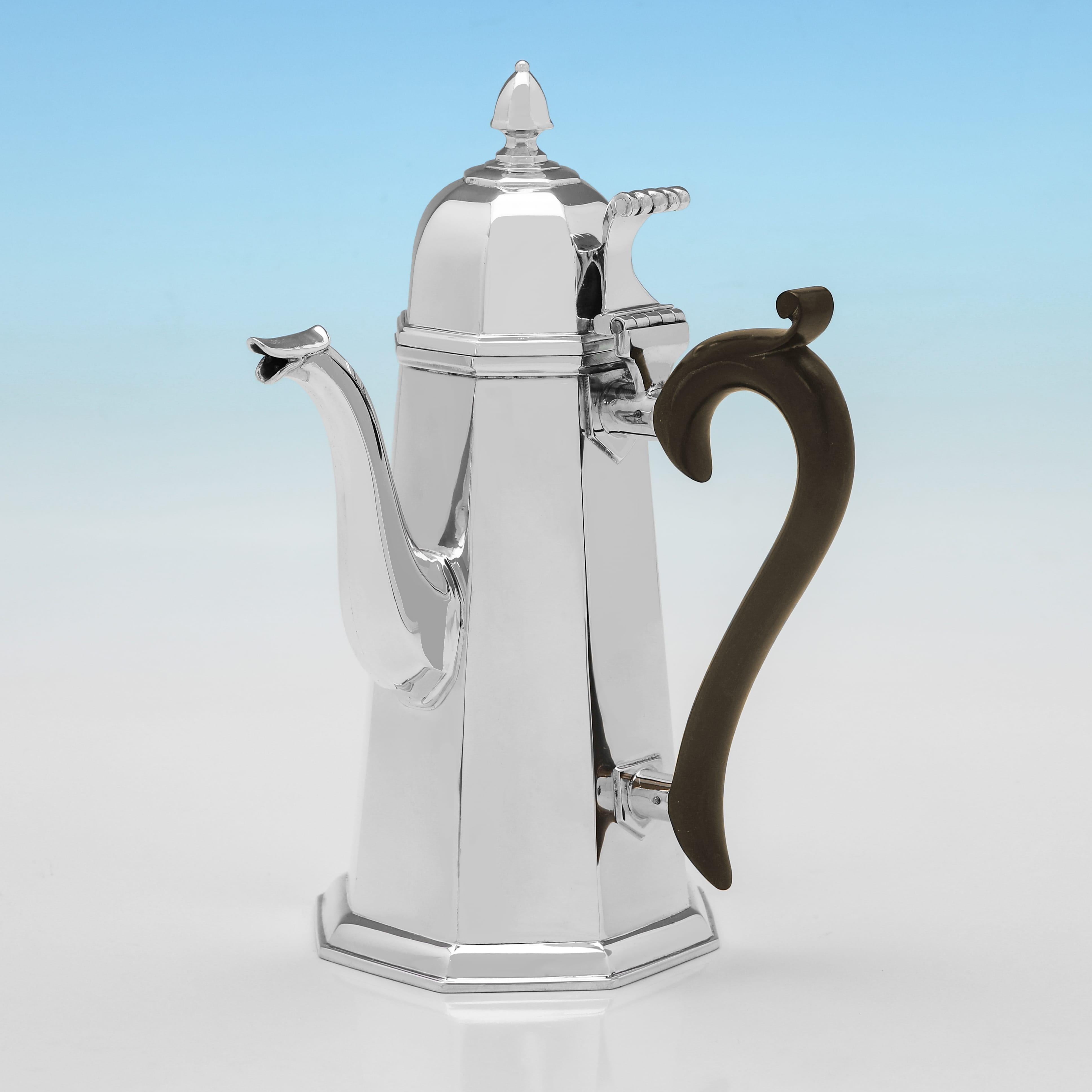 Hallmarked in Chester in 1926 by Jay, Richard Attenborough & Co. Ltd., this handsome, George V period, Sterling Silver Cafe Au Lait, is in the art deco taste, octagonal in shape, and plain in design, with wooden side handles. Together they weigh