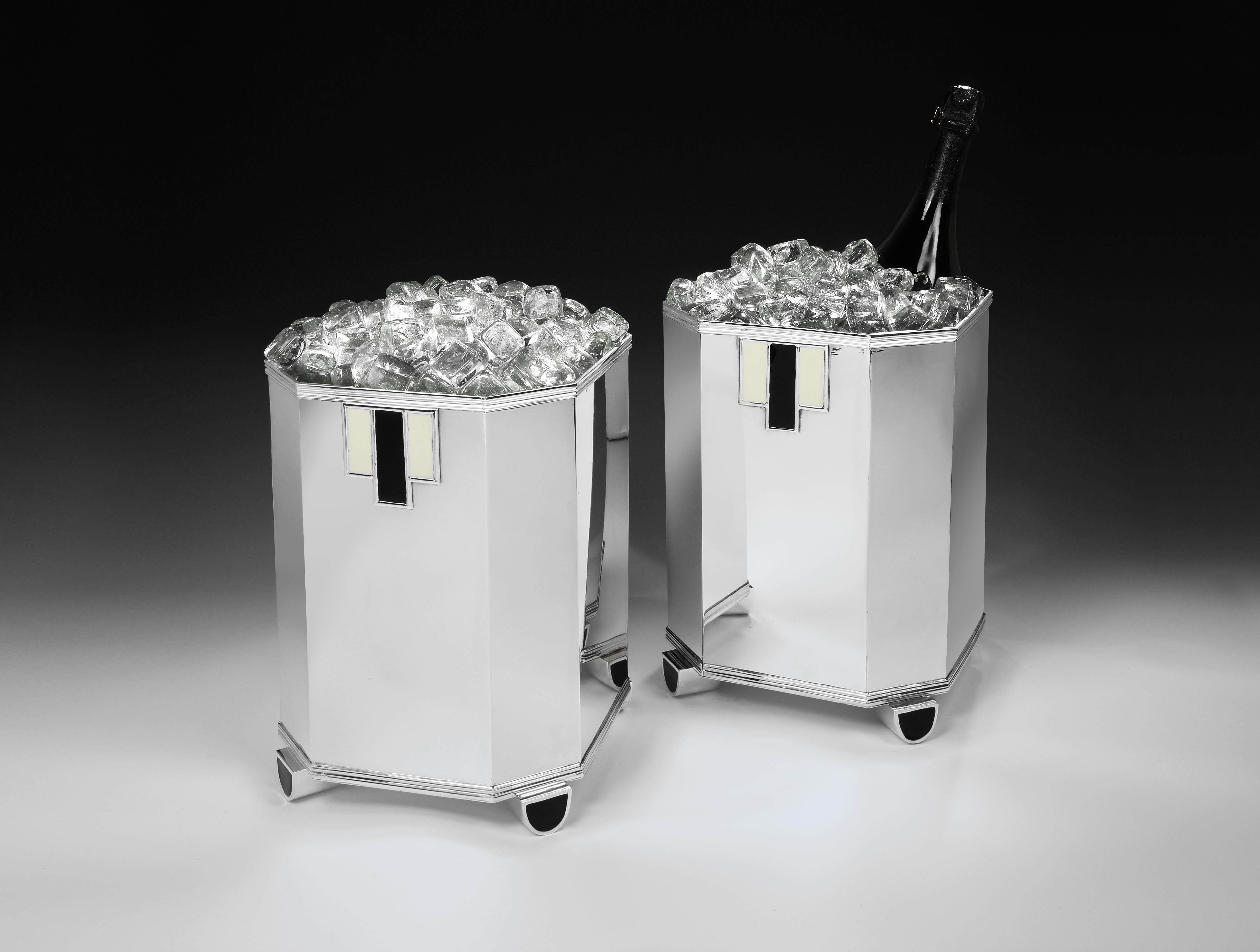 Cardeilhac, Paris 

A showstopping pair of Sterling silver Art Deco Champagne coolers by renowned Parisian silversmiths Cardeilhac. Each geometric cooler has eight sides and a deep semi-circular foot set proud of each corner, finished in glossy