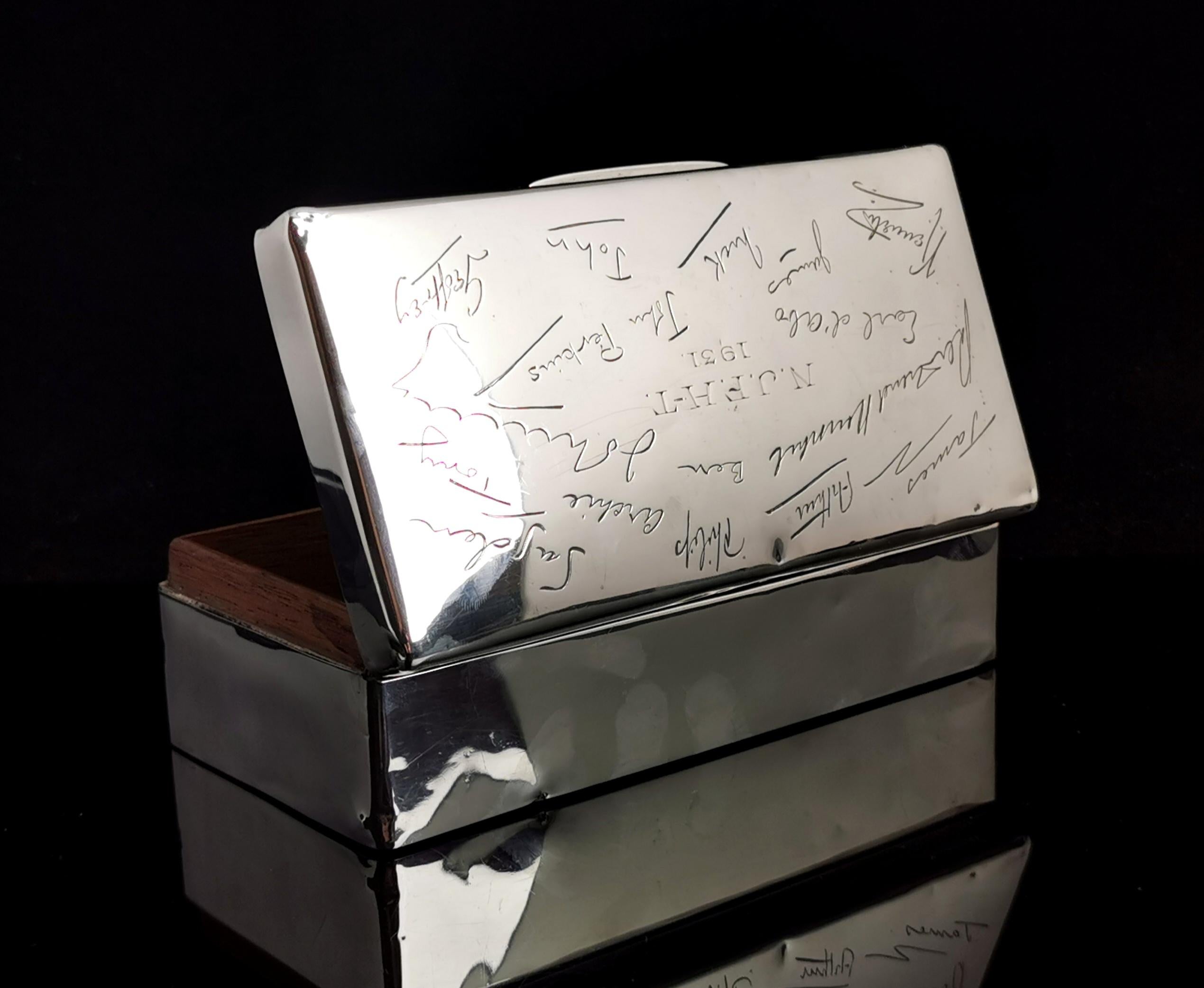 A superb and very interesting vintage 1930's sterling silver cigarette box.

Made from heavy sterling silver with an all over engraved lid, the fantastic thing about this box is that it has been engraved with the individual signatures of people,