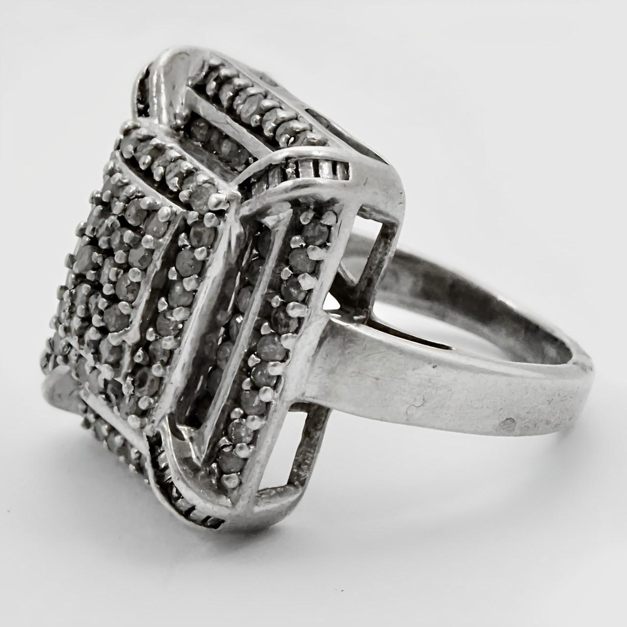 Fabulous Art Deco sterling silver cocktail ring set with two layers of rhinestones. Ring size UK H 1/2, US 4, and measuring inside diameter approximately 1.6 cm / .6 inch. The front measures approximately 1.6 cm / .6 inch by 1.7 cm / .66 inch. The