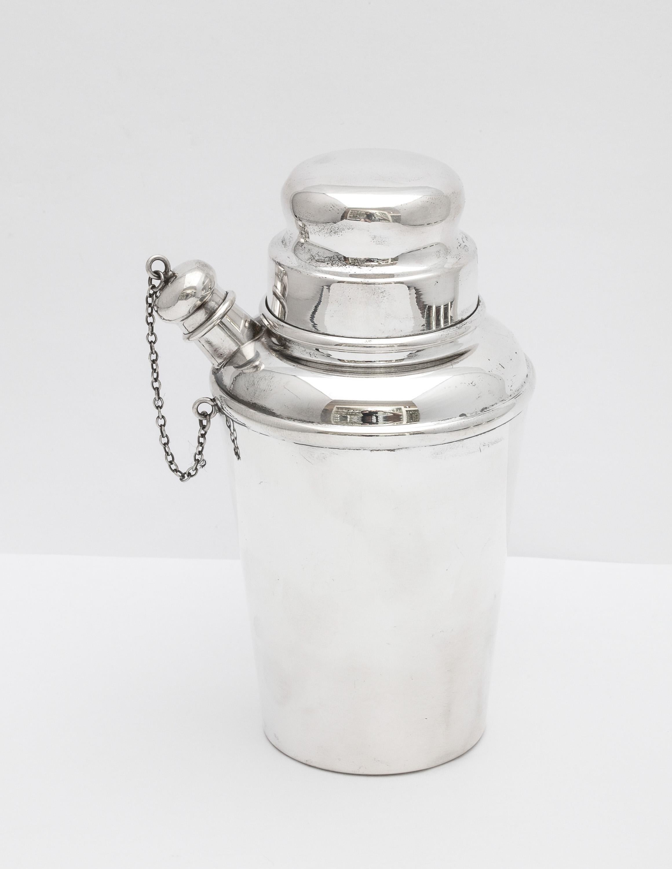 Art Deco, sterling silver cocktail shaker, New York, Ca. 1930's, Currier and Roby - makers. Measures: 5 3/4 inches high (at highest point) x 3 inches diameter at widest point x 2 1/4 inches diameter across base. Weighs 4.875 troy ounces. Has some