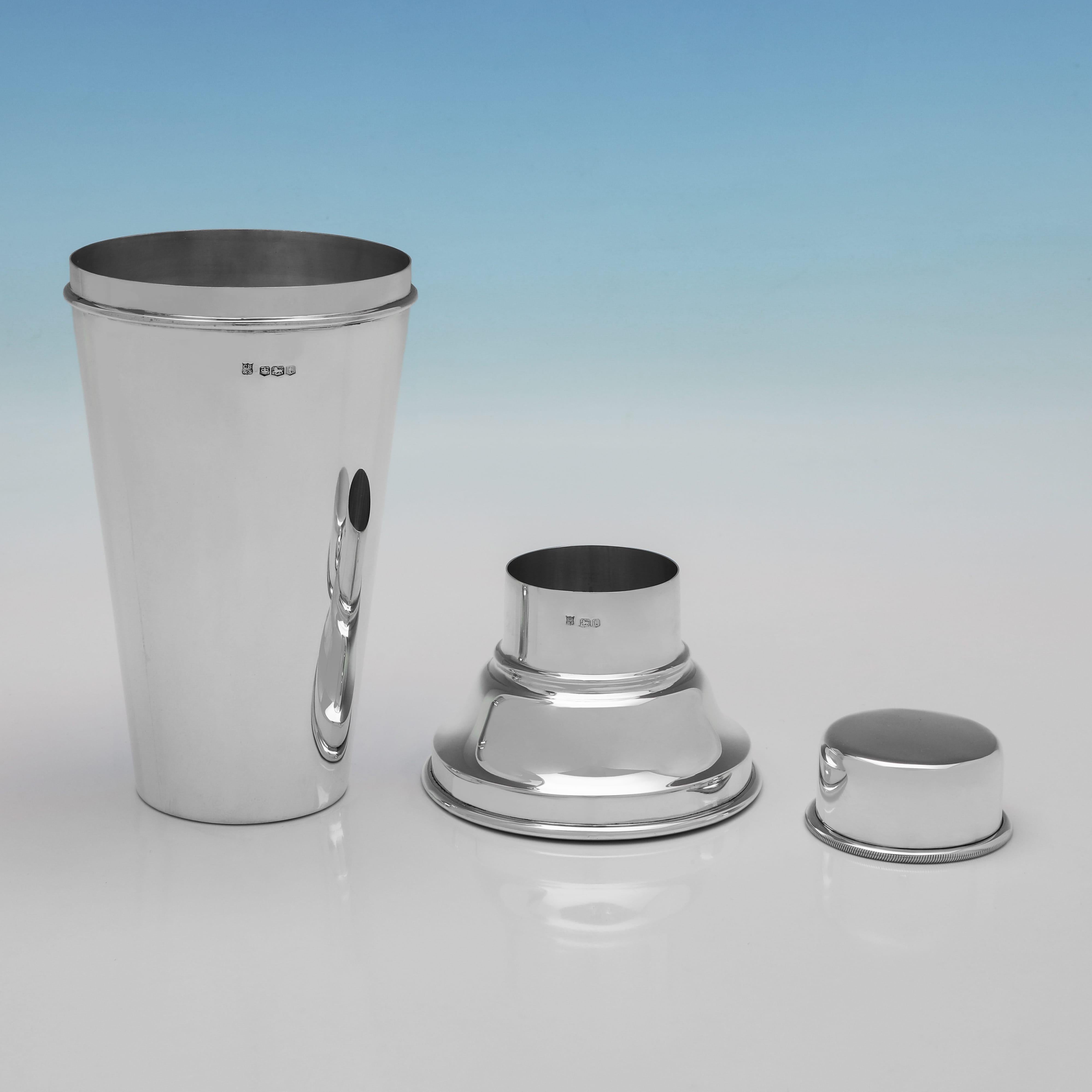 Hallmarked in Sheffield in 1936, this sterling silver cocktail shaker was made by Cooper Brothers & Sons and reflects the clean, functional lines associated with the Art Deco period. The design is well-balanced and minimal, with a polished finish