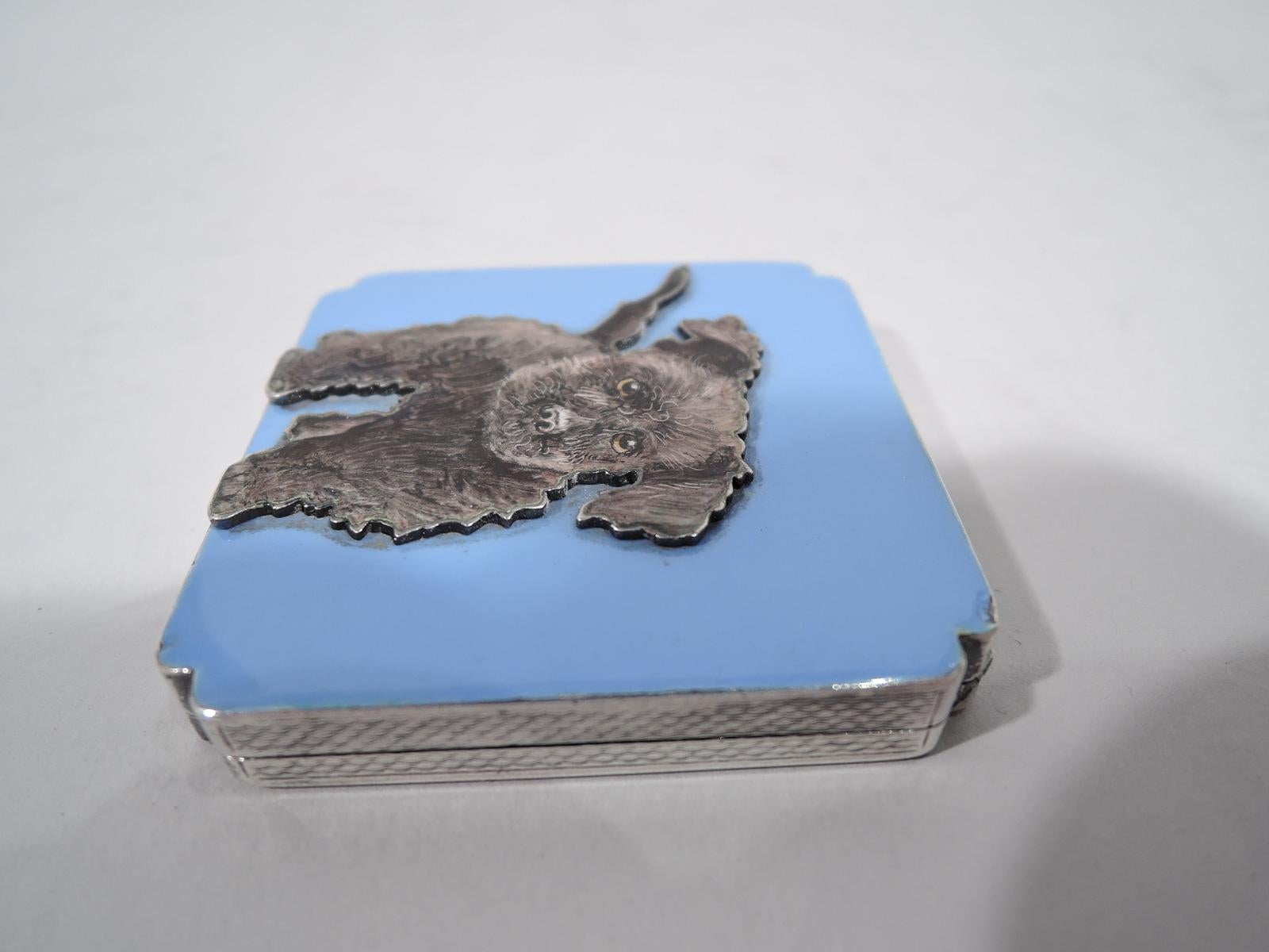 Art Deco sterling silver and enamel compact, ca 1920. Square and hinged with lobed corners. On cover a black wiggly, wiry terrier quivering with love is cutout and applied to a solid lilac purple ground. Back and sides have engine-turned wave