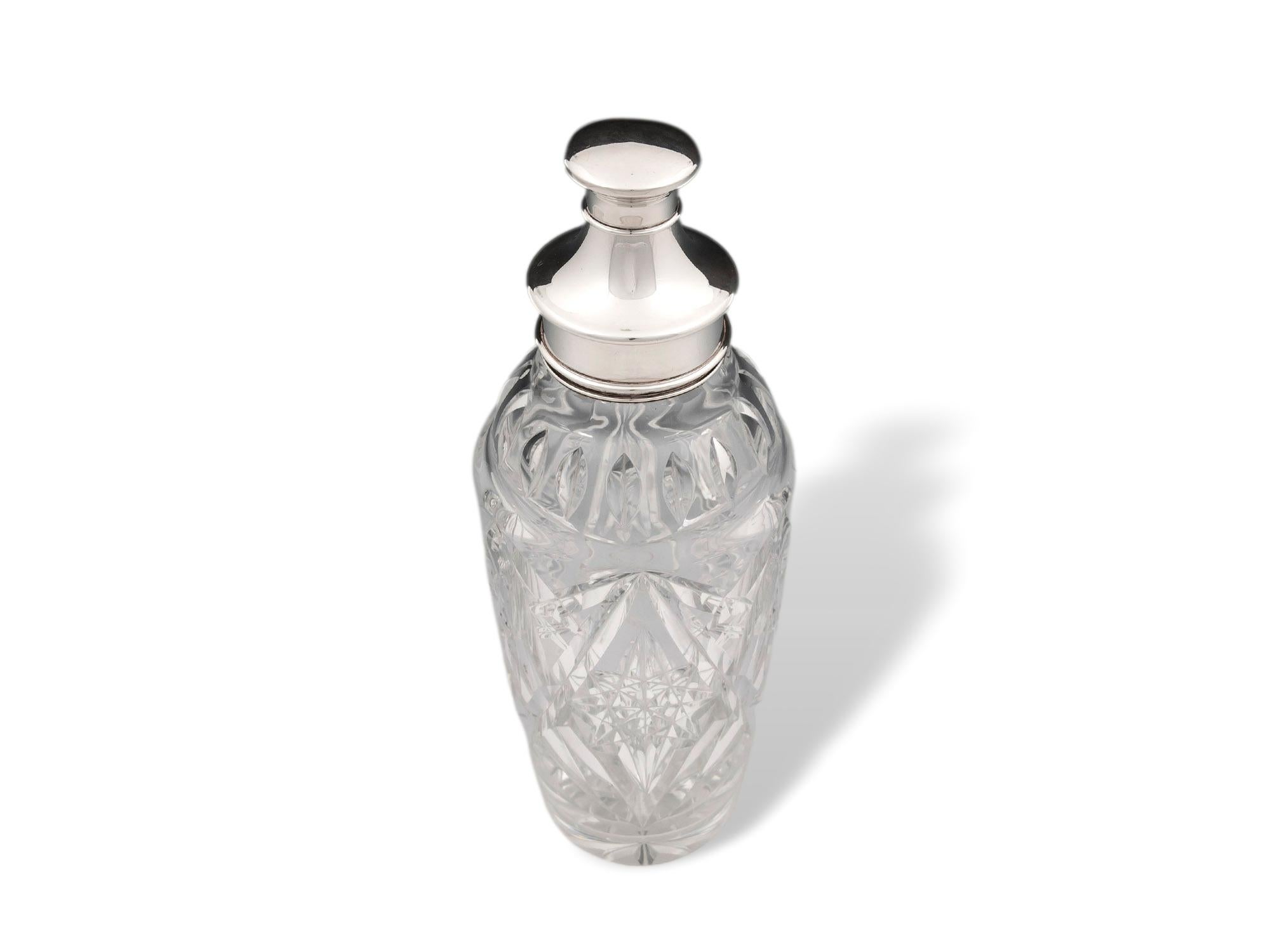 From the Art Deco Period Dated 1930

From our Barware collection, we are delighted to offer this Art Deco Silver & Glass Cocktail Shaker. The Cocktail Shaker of long oval form with a tapered hand-cut clear glass body of good weight featuring a