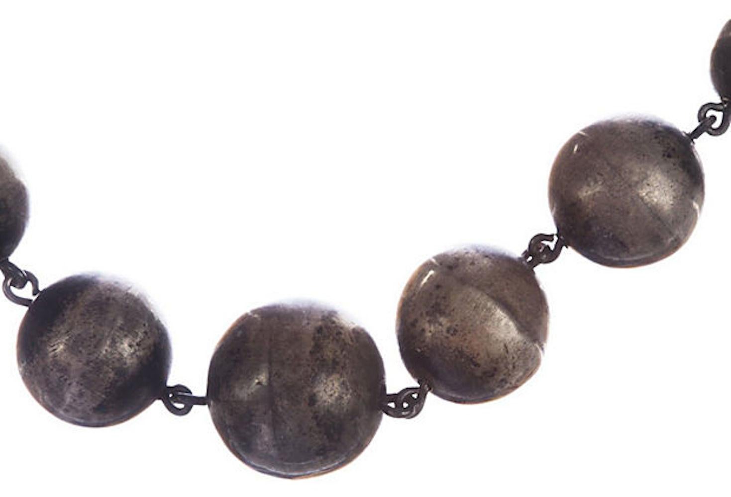 Art Deco handmade sterling silver graduated bead necklace with original patina, circa 1930. Beads range from 10 mm to 17.5 mm. Acid tested for sterling silver. Weight: 40.4 grams. Closes with hook clasp and a triangle eye lit. Necklace measures