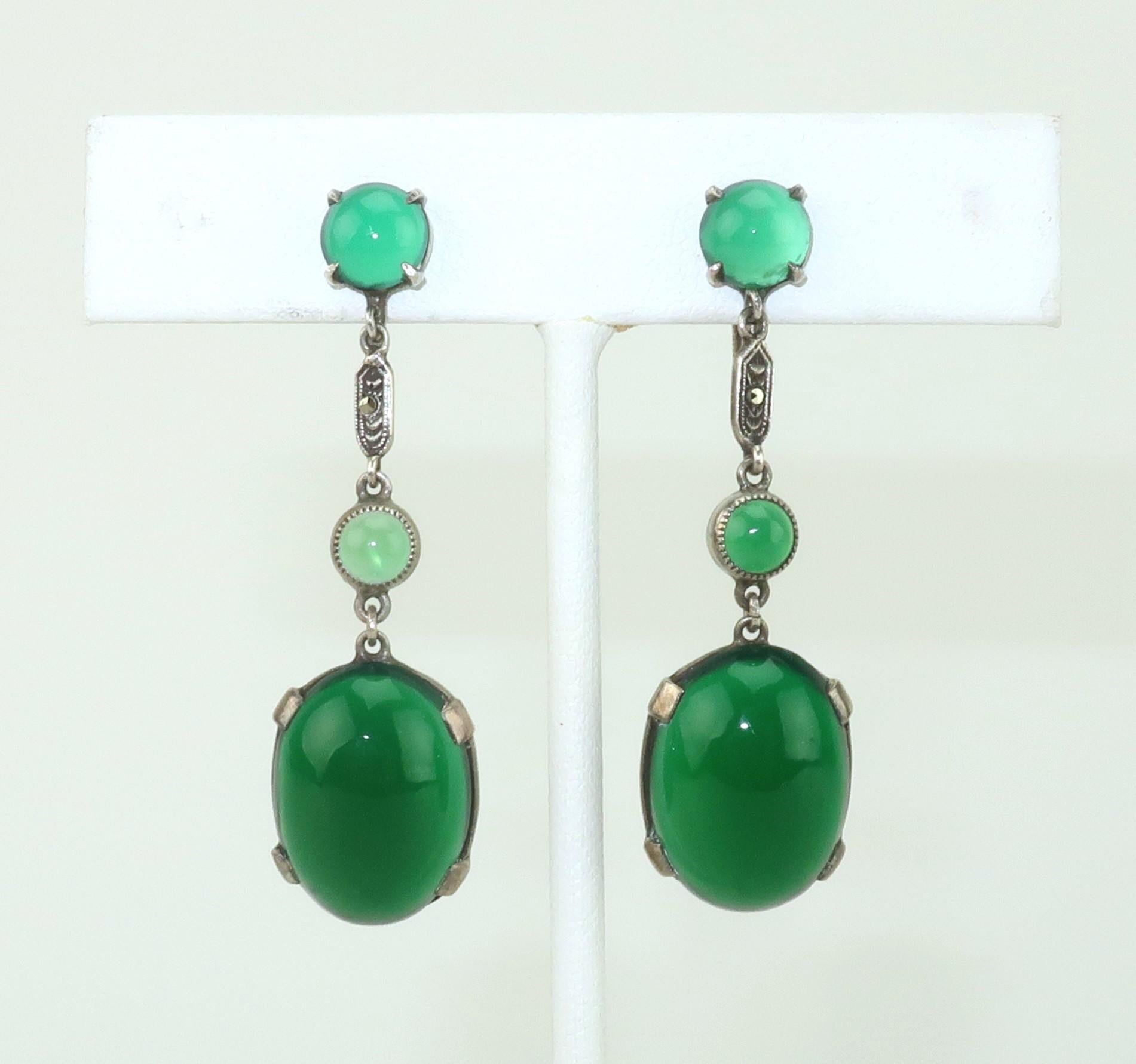 Elegant art deco drop earrings designed in sterling silver accented with green chrysoprase quartz in cabochon cuts.  A little marcasite is added for sparkle and a touch of flapper style glam.  Outfitted with screw back hardware and marked 'sterling'