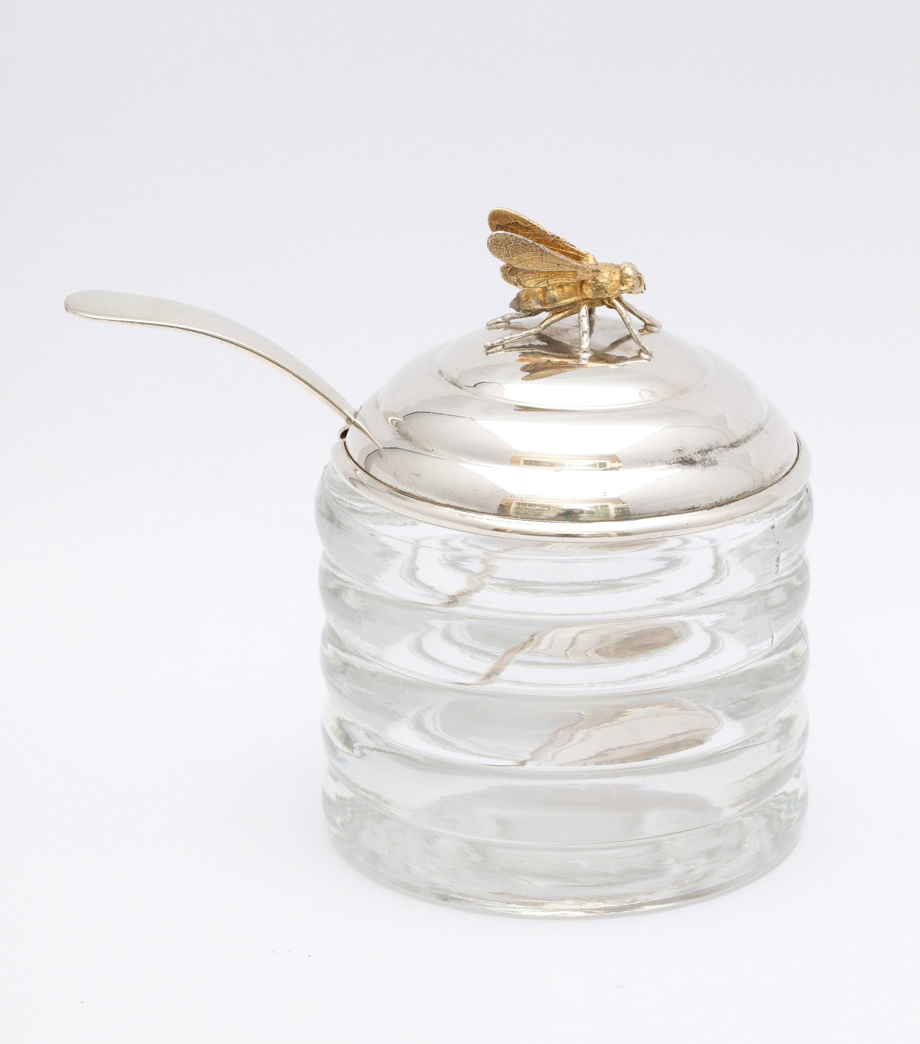 Unusual, Art Deco, sterling silver-mounted beehive-form honey jar with its original sterling silver honey spoon, R. Blackinton and Co., No. Attleboro, Mass., circa 1930s. Glass jar is in the form of a beehive, sterling silver lid is topped by a