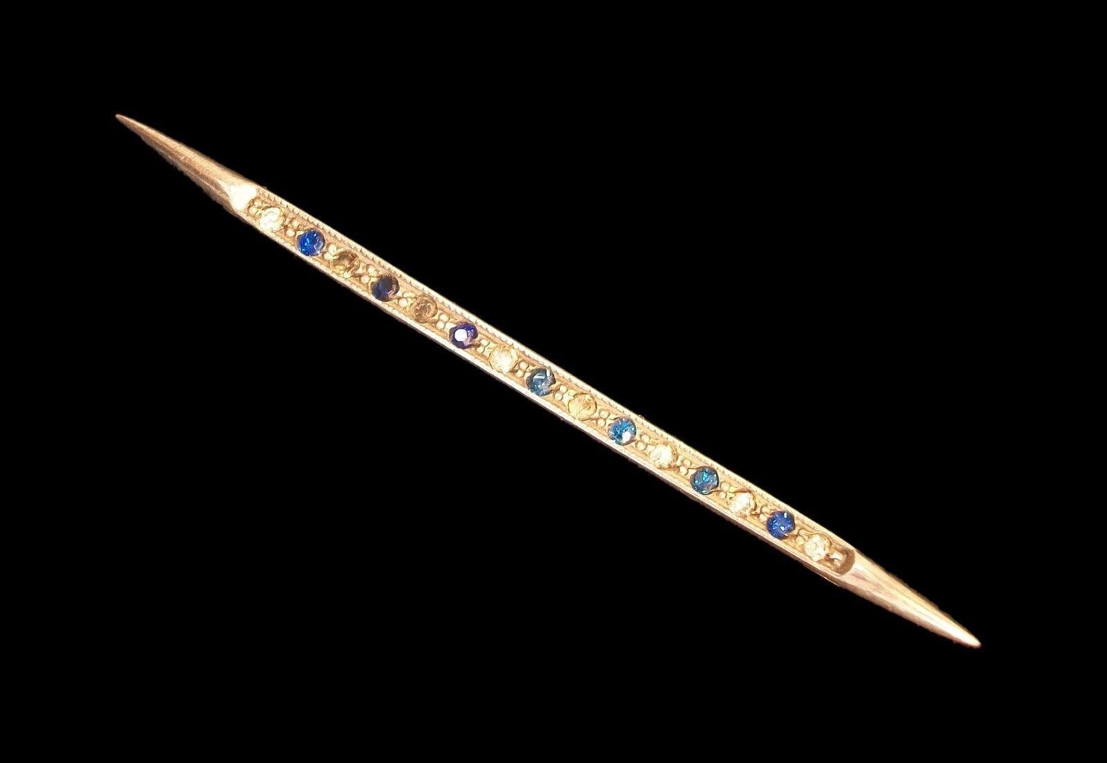 Art Deco sterling silver bar brooch/pin set with blue and clear rhinestones (faux sapphires and diamonds) - original reverse safety catch and pin with round hinge - unsigned - United States (likely) - circa 1930's.

Excellent antique condition - all