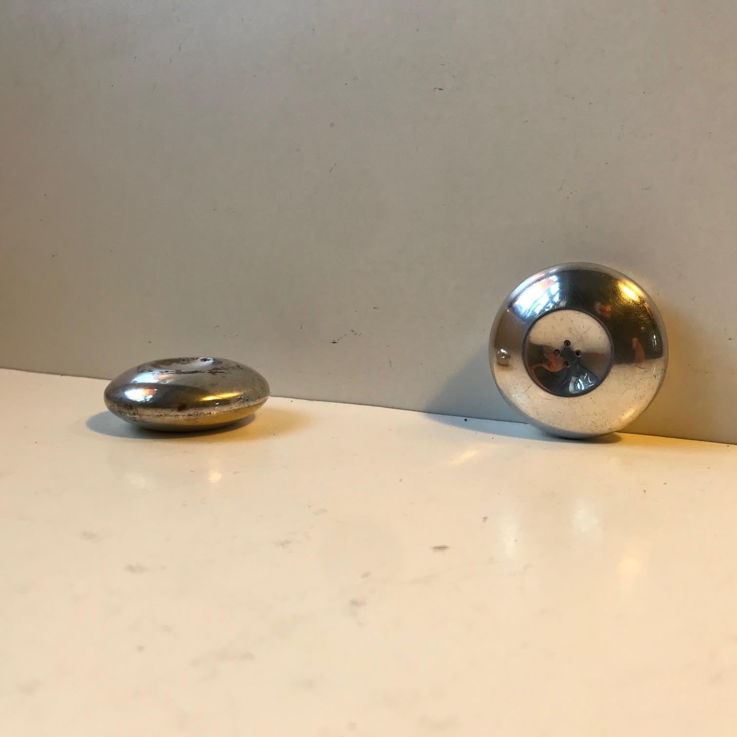 A rare travel set consisting of salt and pepper shakers in sterling silver. Designed prior to 1920 by Hans Hansen and manufactured by Cohr in Denmark. Both shakers are imprinted: Cohr, Sterling, HH, Denmark.