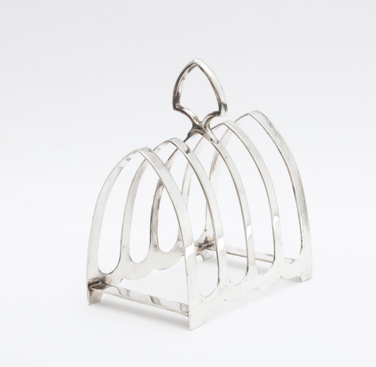 Art Deco, sterling silver toast rack, Sheffield, England, year-hallmarked for 1932, The toast rack has the maker's mark of Richard Woodman Burbridge for Harrods. Richard Woodman Burbridge was chairman of Harrods; his initials were used as the