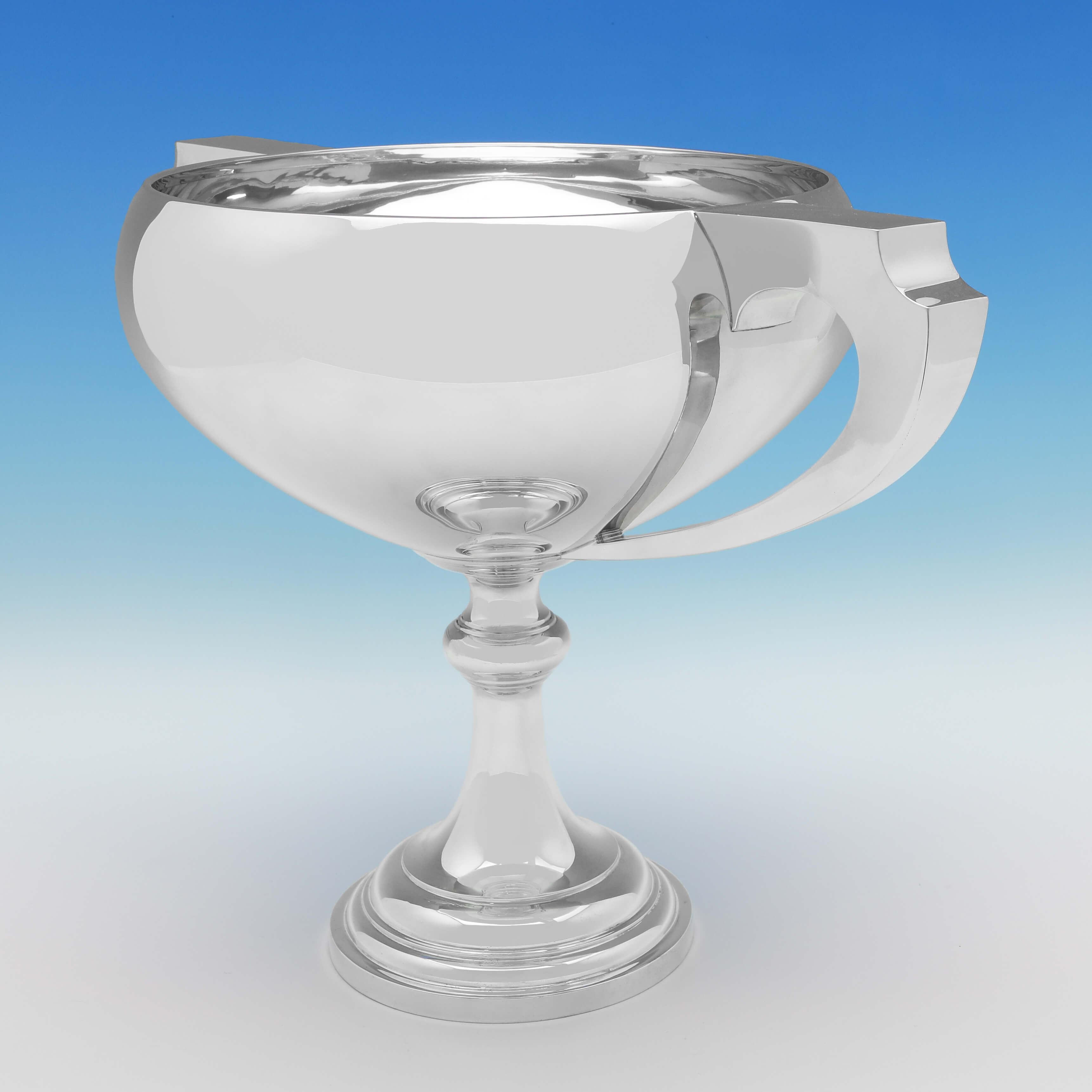 Hallmarked in Birmingham in 1937 by Mappin & Webb, this very handsome, Sterling Silver Trophy, is in the Art Deco taste, and plain in style. The trophy measures 12.75