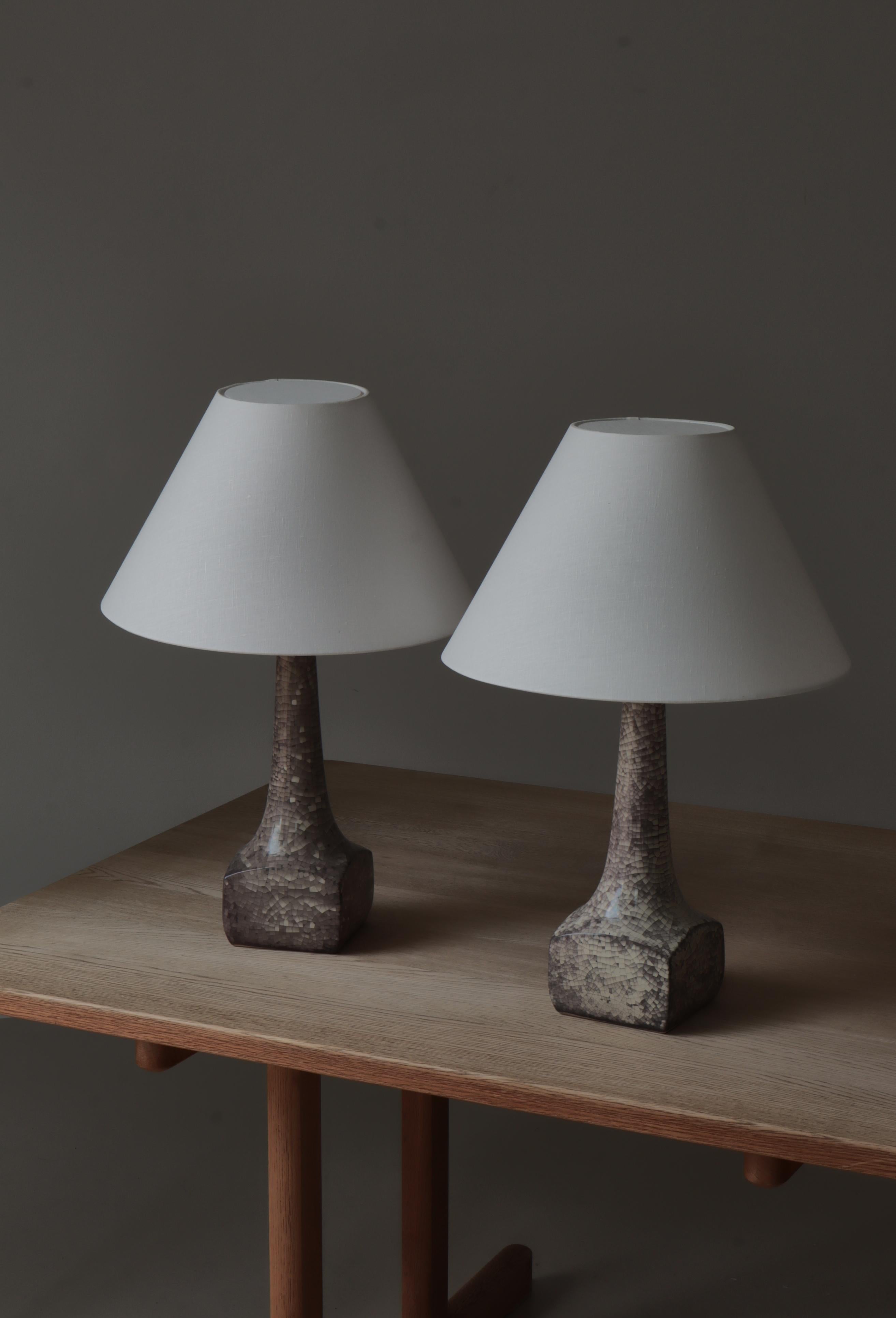 Rare set of Danish Art Deco table lamps made by Michael Andersen & Sons in the 1940s. The lamp bases are made from stoneware with a grey / purple craquelé 