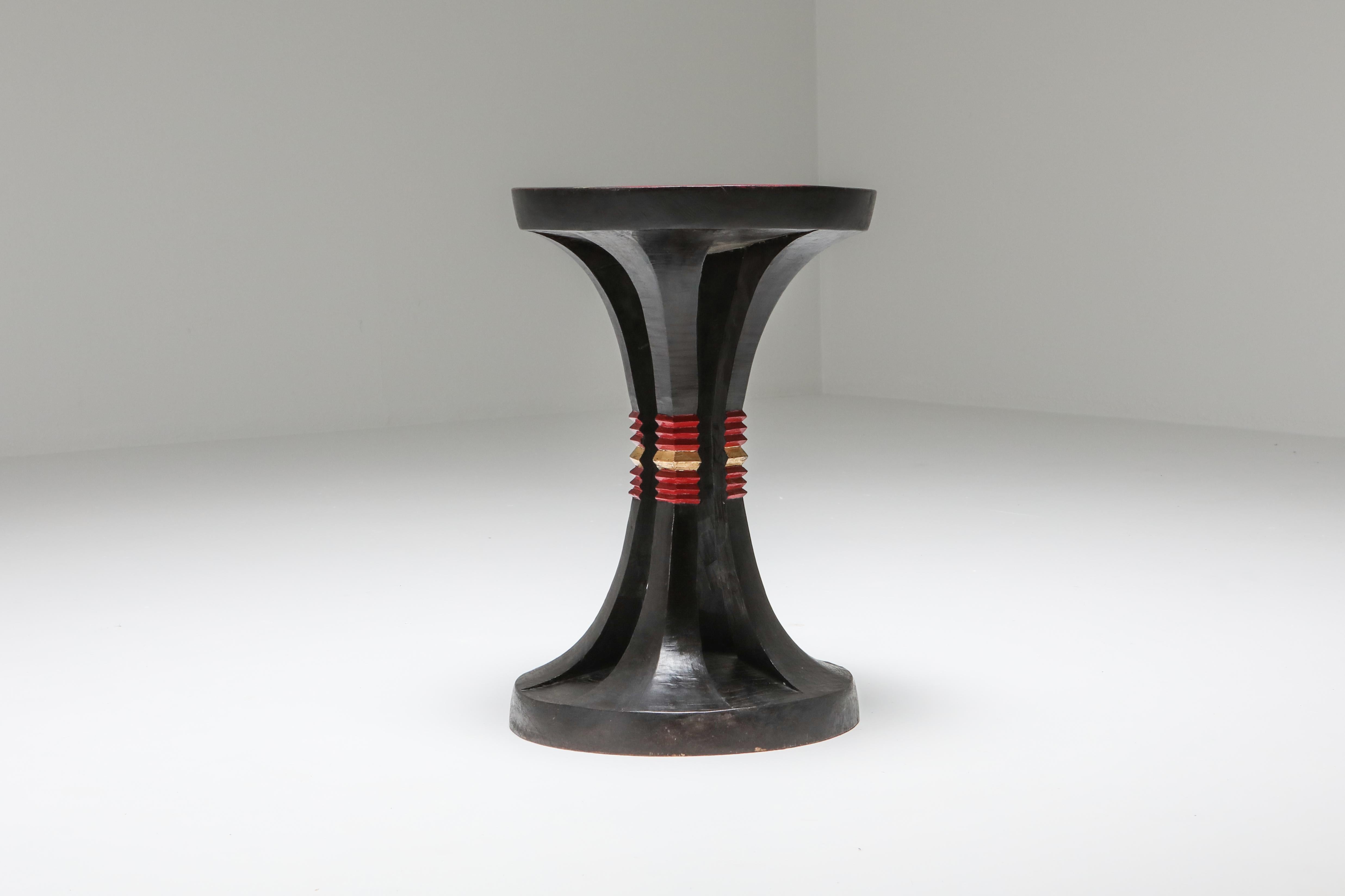French 1940s stool in ebonized wood, with red lacquer and gold leaf

Would fit well in an eclectic evocative decor inspired by Kelly Wearstler.
       