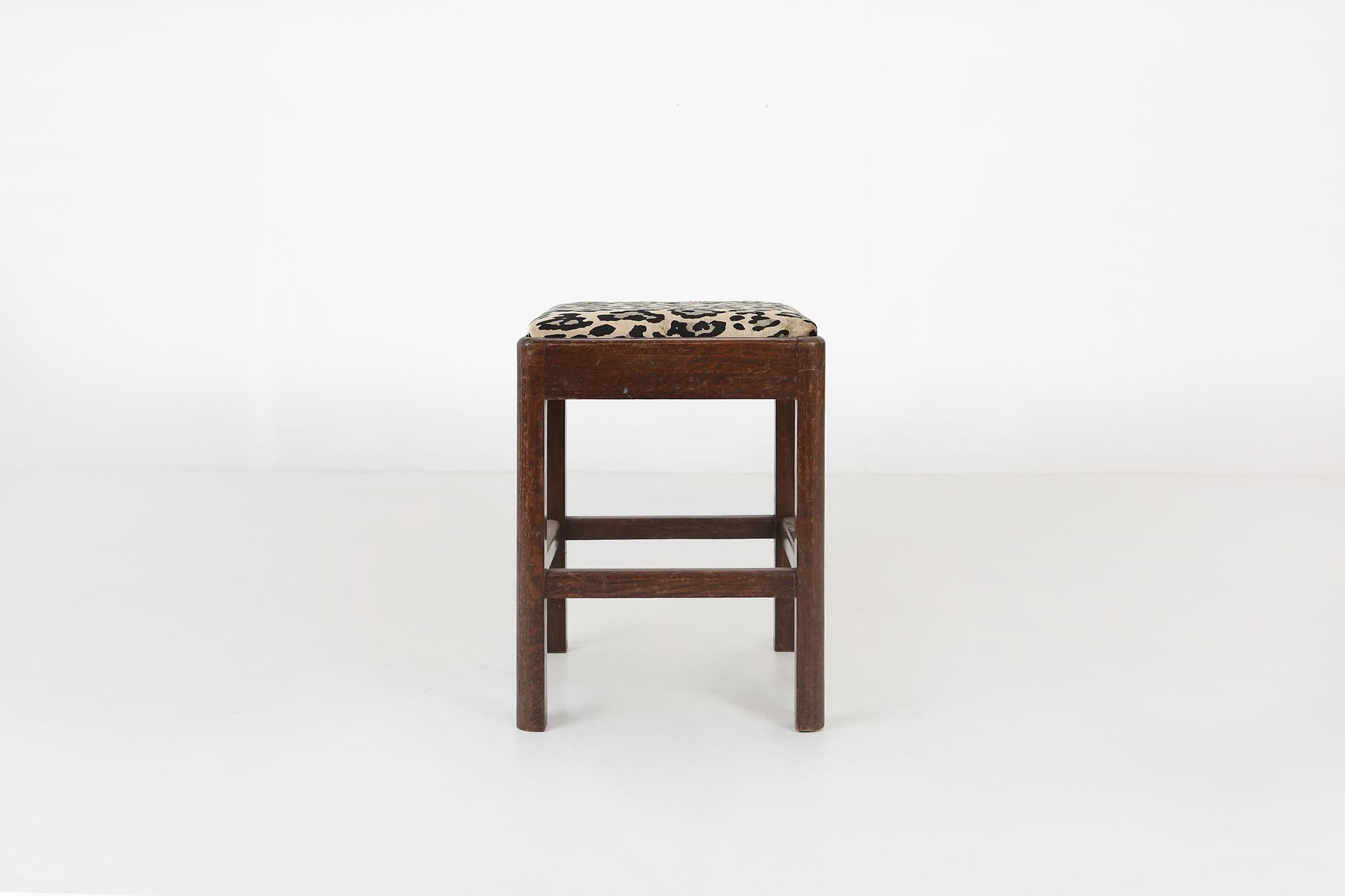 Art Deco stool made around 1930 with a new upholstered fabric in leopard print.