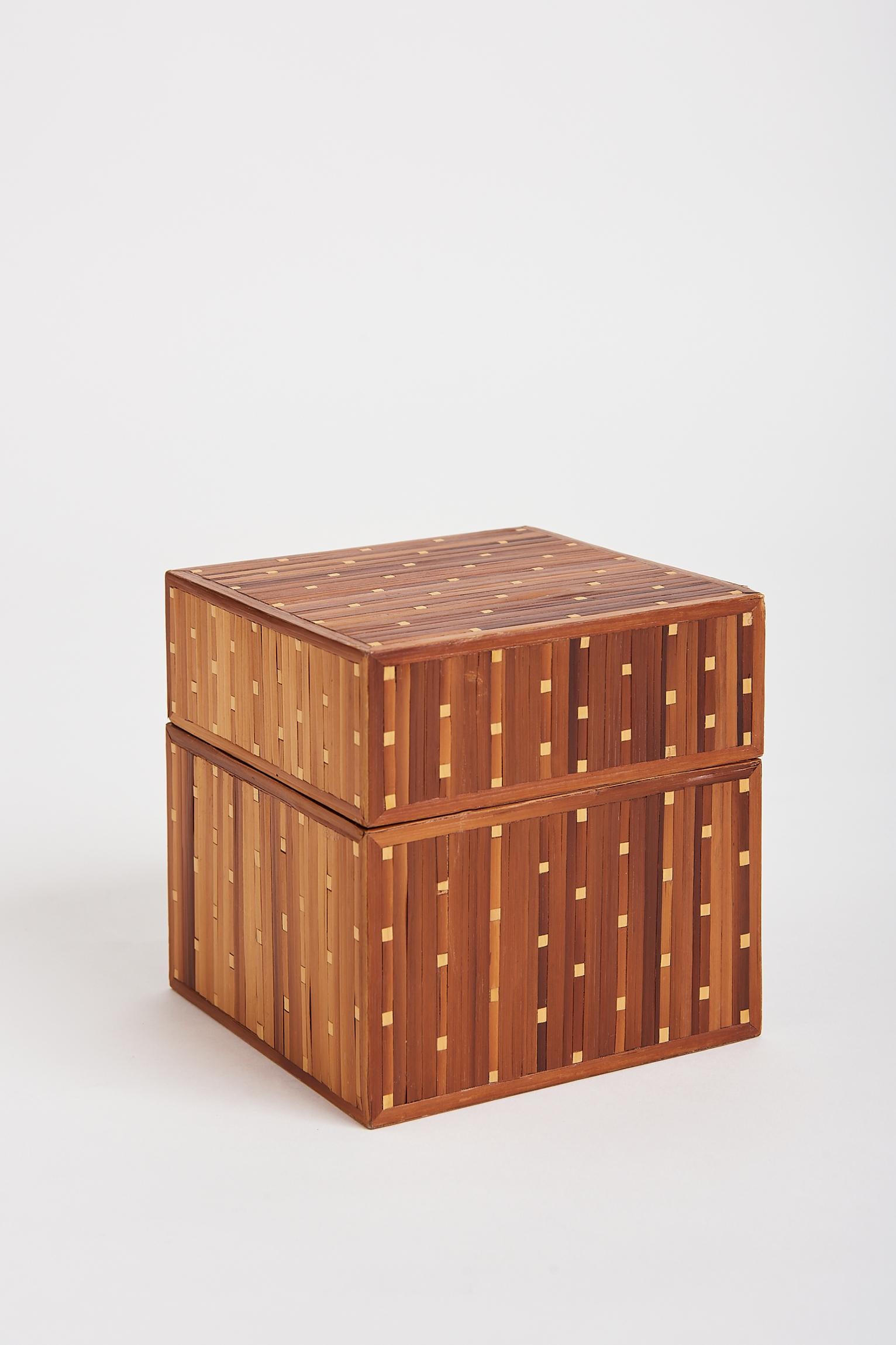 An Art Deco straw marquetry cubic box.
France, Circa 1930.