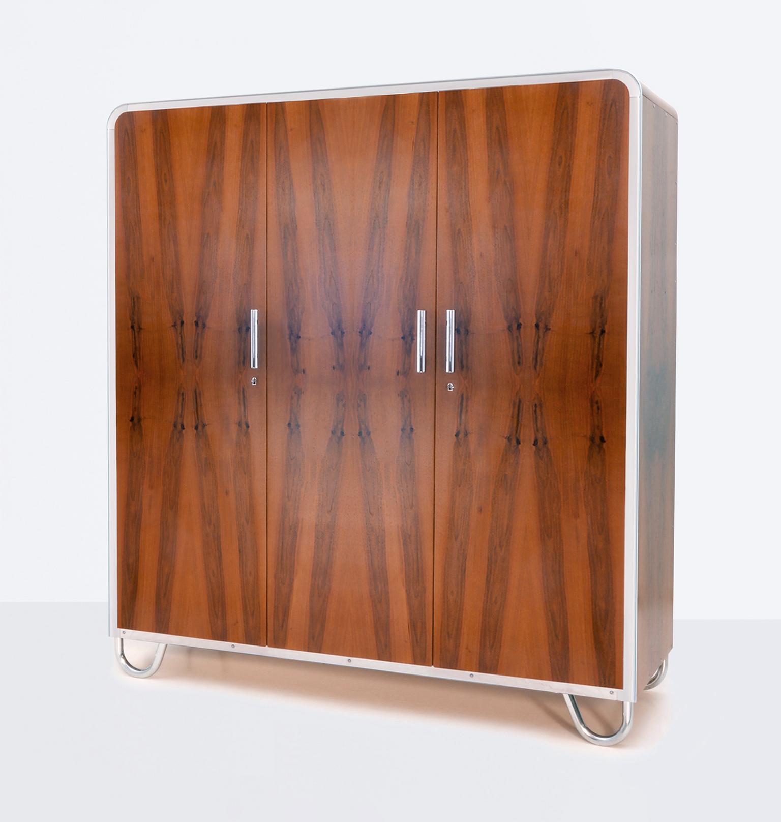 Art Deco- streamline 3-door wardrobe designed by Arch. Hana Kucerová-Záveská (Czech, 1904–1944) and manufactured by Robert Slezák Company, circa 1935. The outstanding form of this wardrobe is the expression of a modern and innovative design as