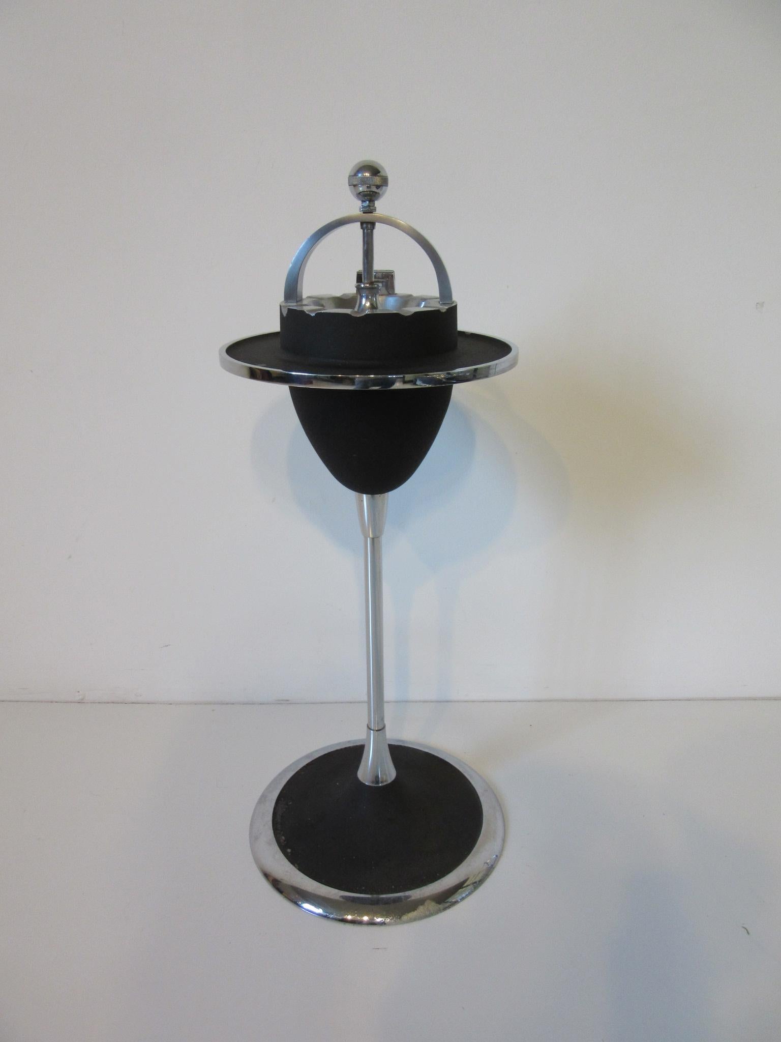 Art Deco train car solid steel, nickel and satin black painted ash tray stand with matchbox holder and handle. A strong styling statement from the period of train cars and Industrial design, manufactured by the W.J. Campbell Company Indianapolis.