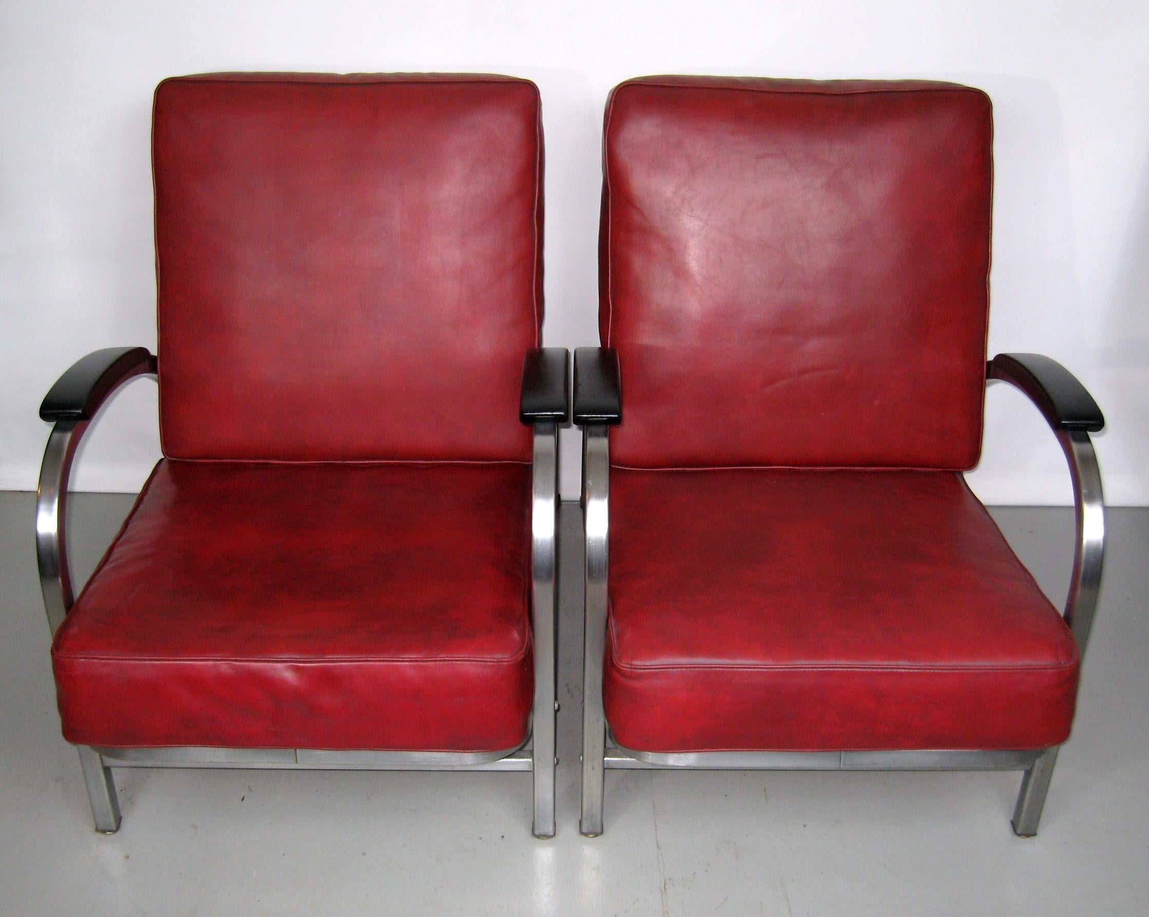 Absolutely extraordinarily well preserved set of tubular club chairs in the style and era of Wolfgang Hoffman, Kem Weber, and Gilbert Rohde. Streamline Art Deco modernism of the 1930s well represented in this set. Original dark red Naugahyde